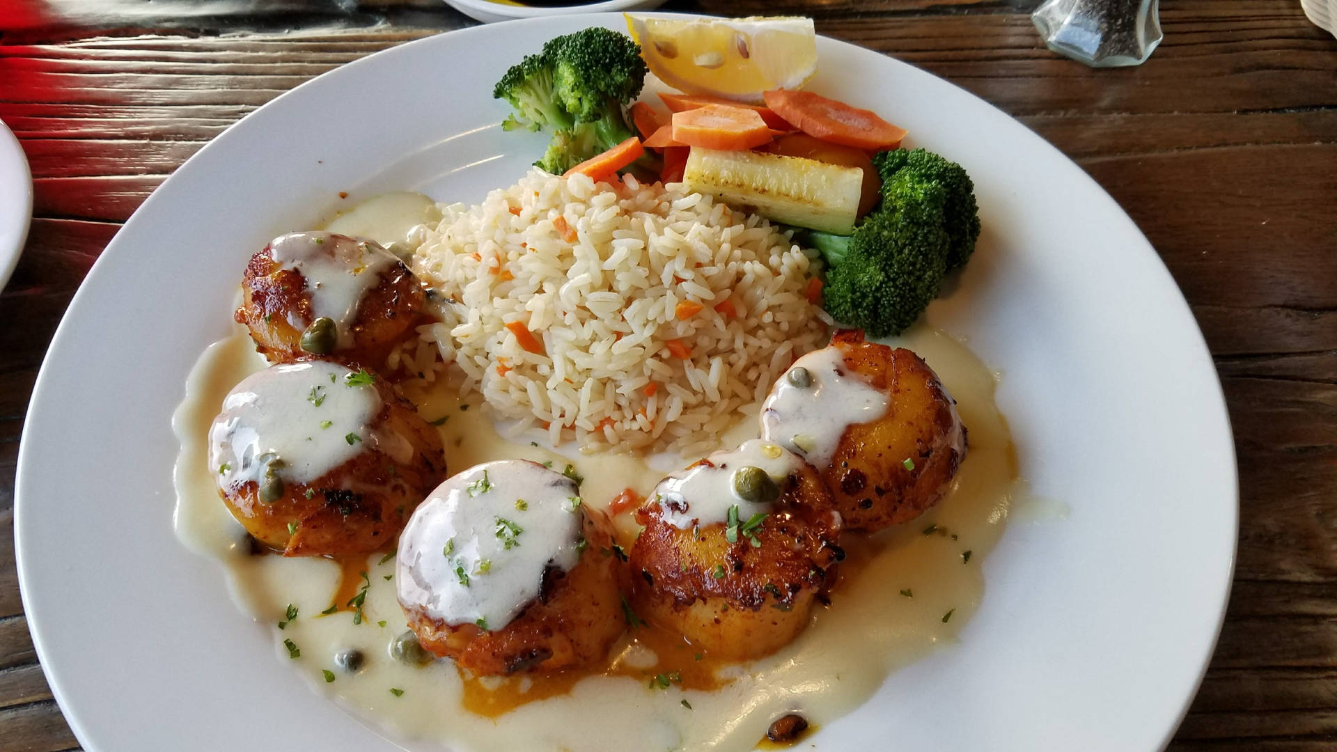 Scallops Dish With Pilaf Rice And Vegetables