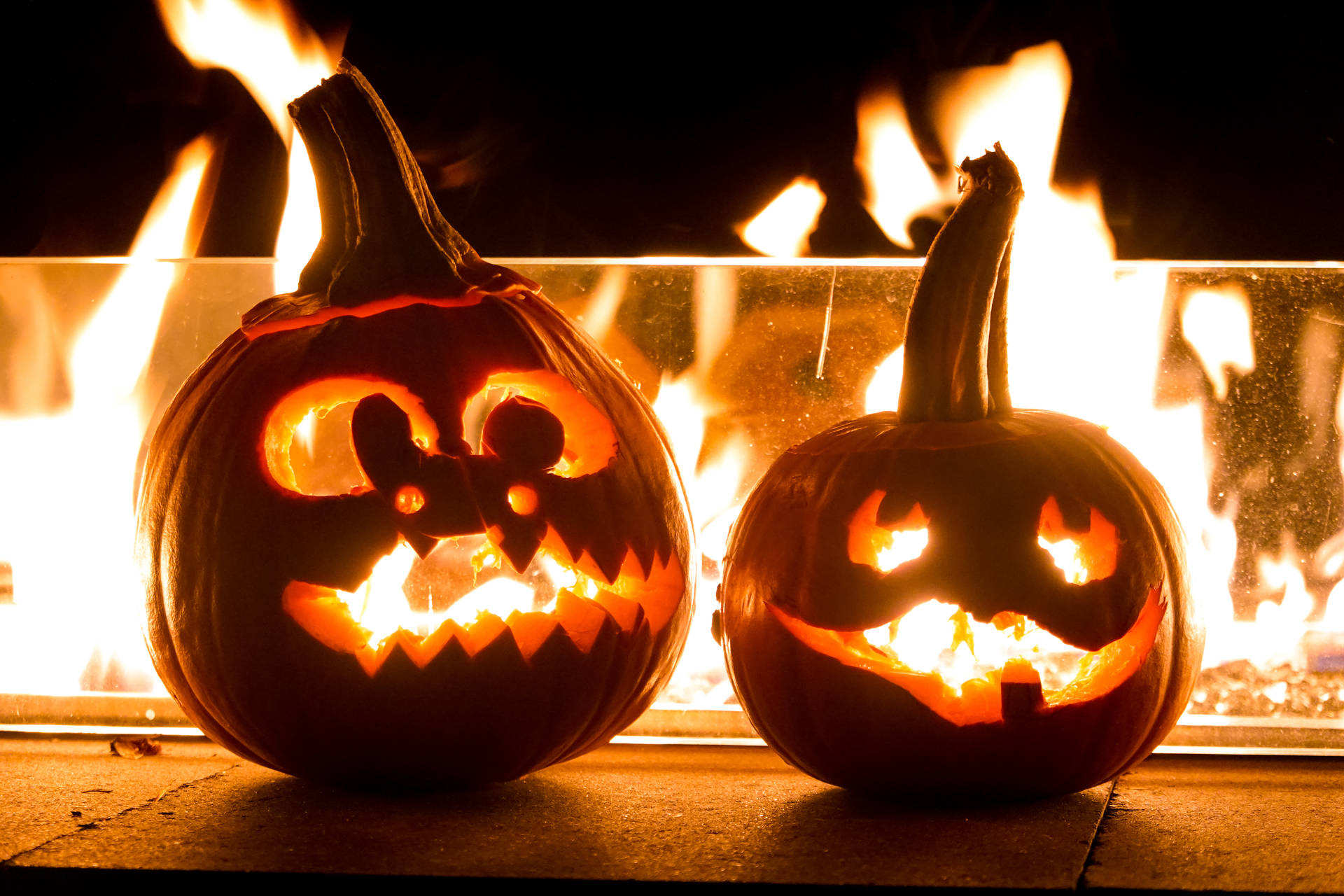Scary Halloween Burning Carved Pumpkins Background