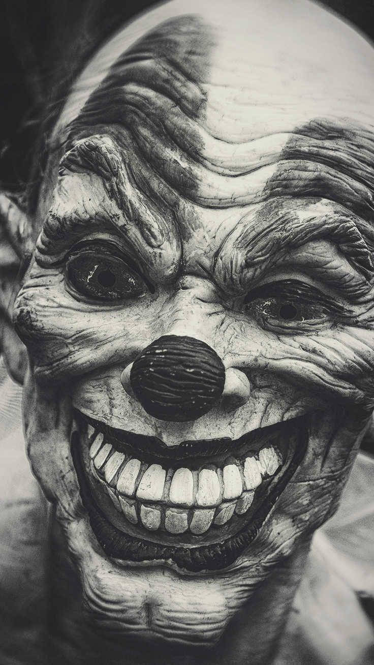 Scary Halloween Greyscale Clown Mask Background