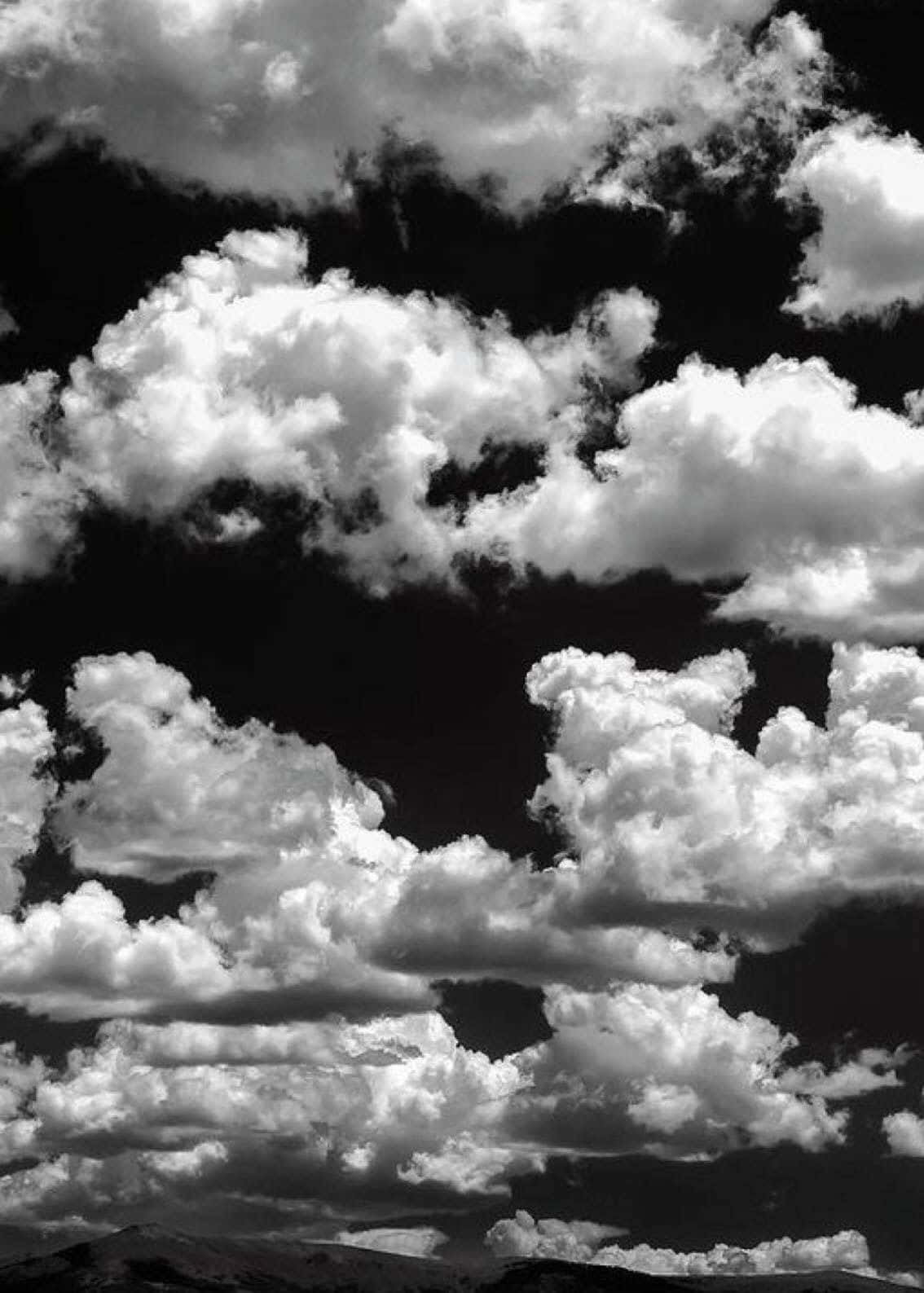 Scattered Black Clouds In The Sky Background