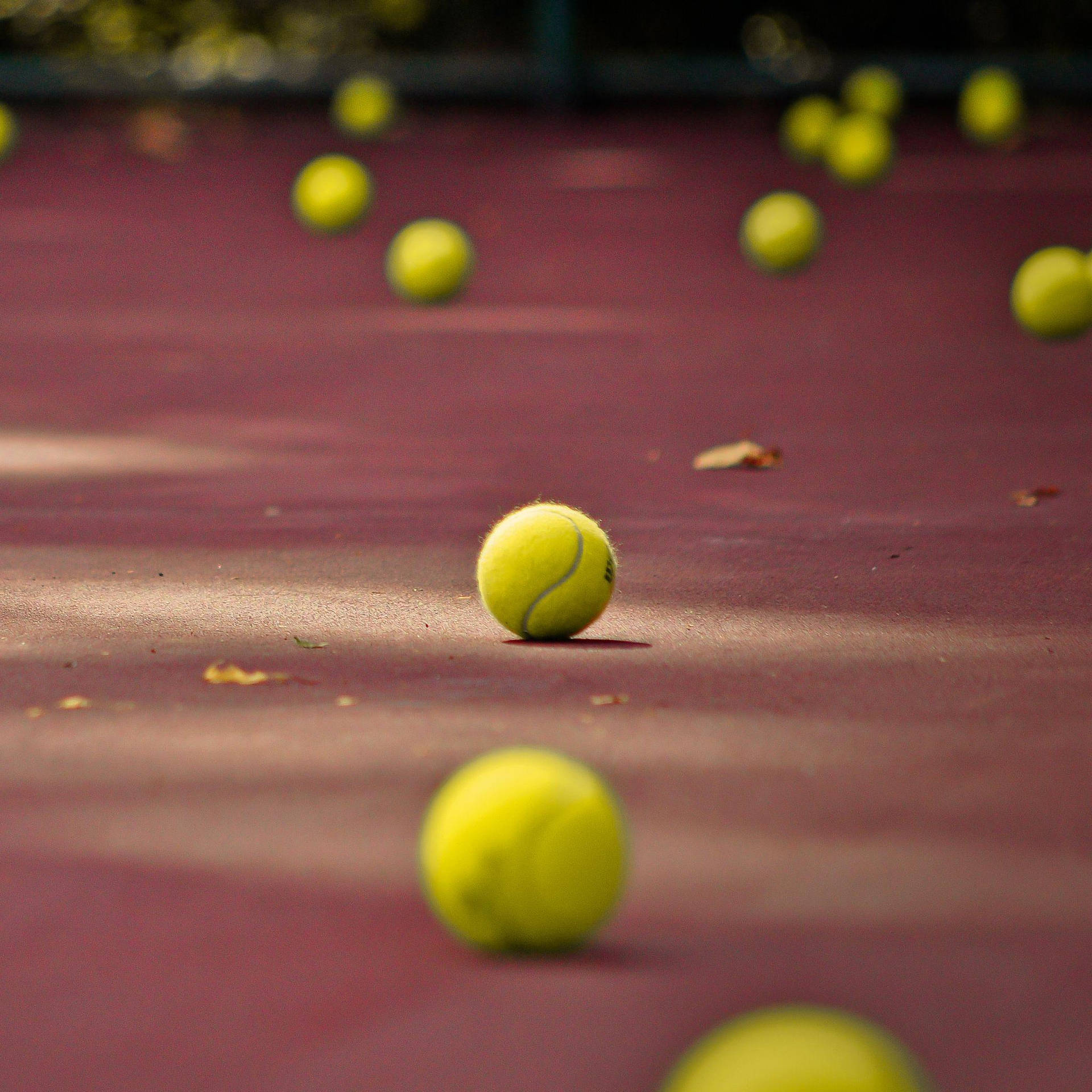 Scattered Tennis Balls Background