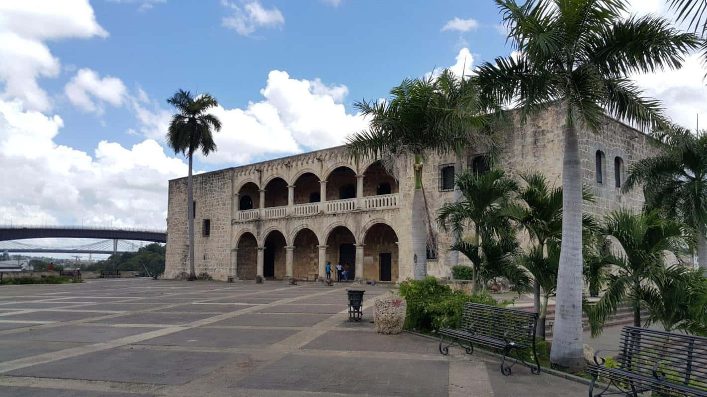Scenic View Of Alcazar De Colon Under A Serene Blue Sky. Background