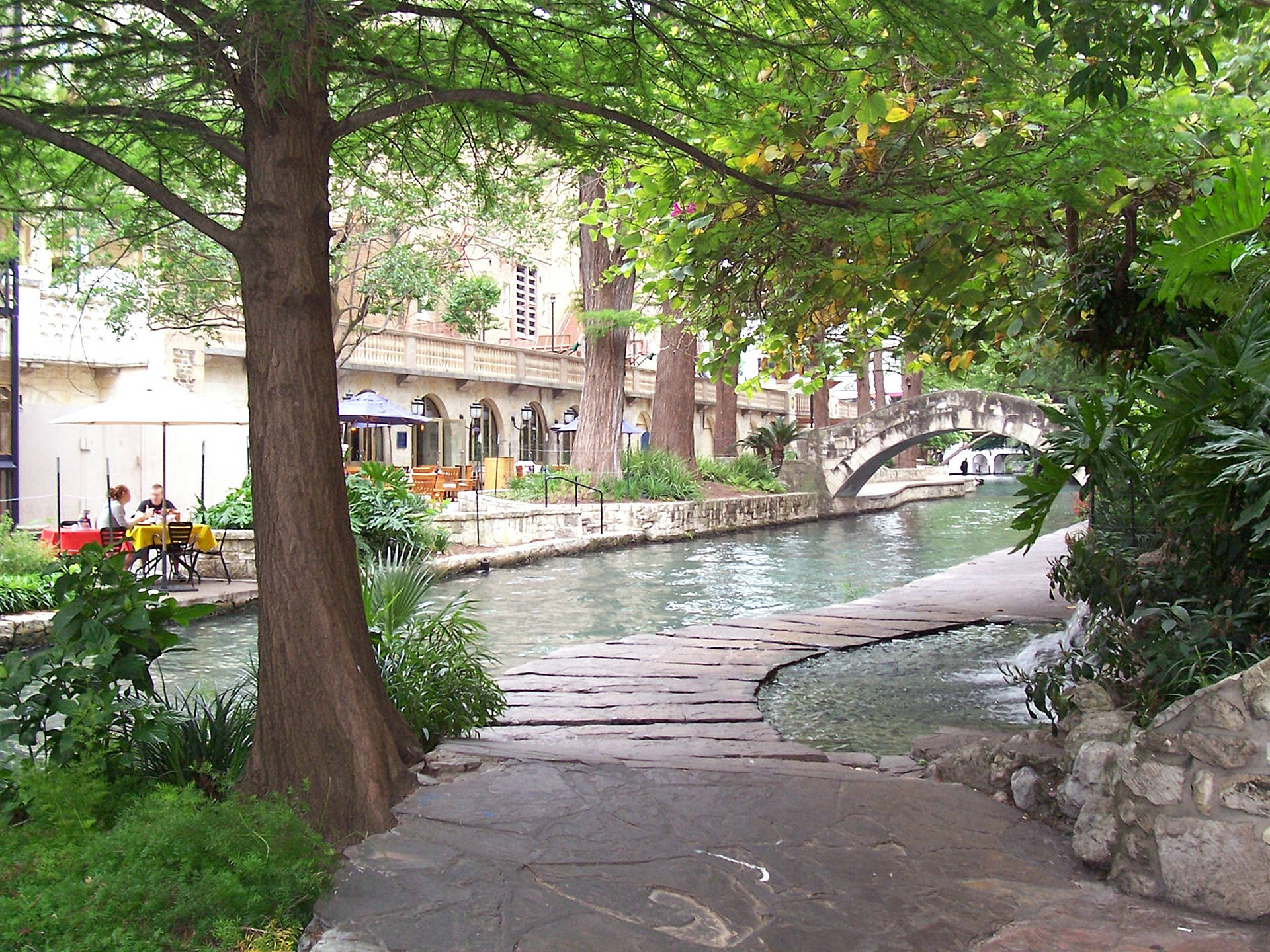 Scenic View Of The Pathway In San Antonio River Walk. Background