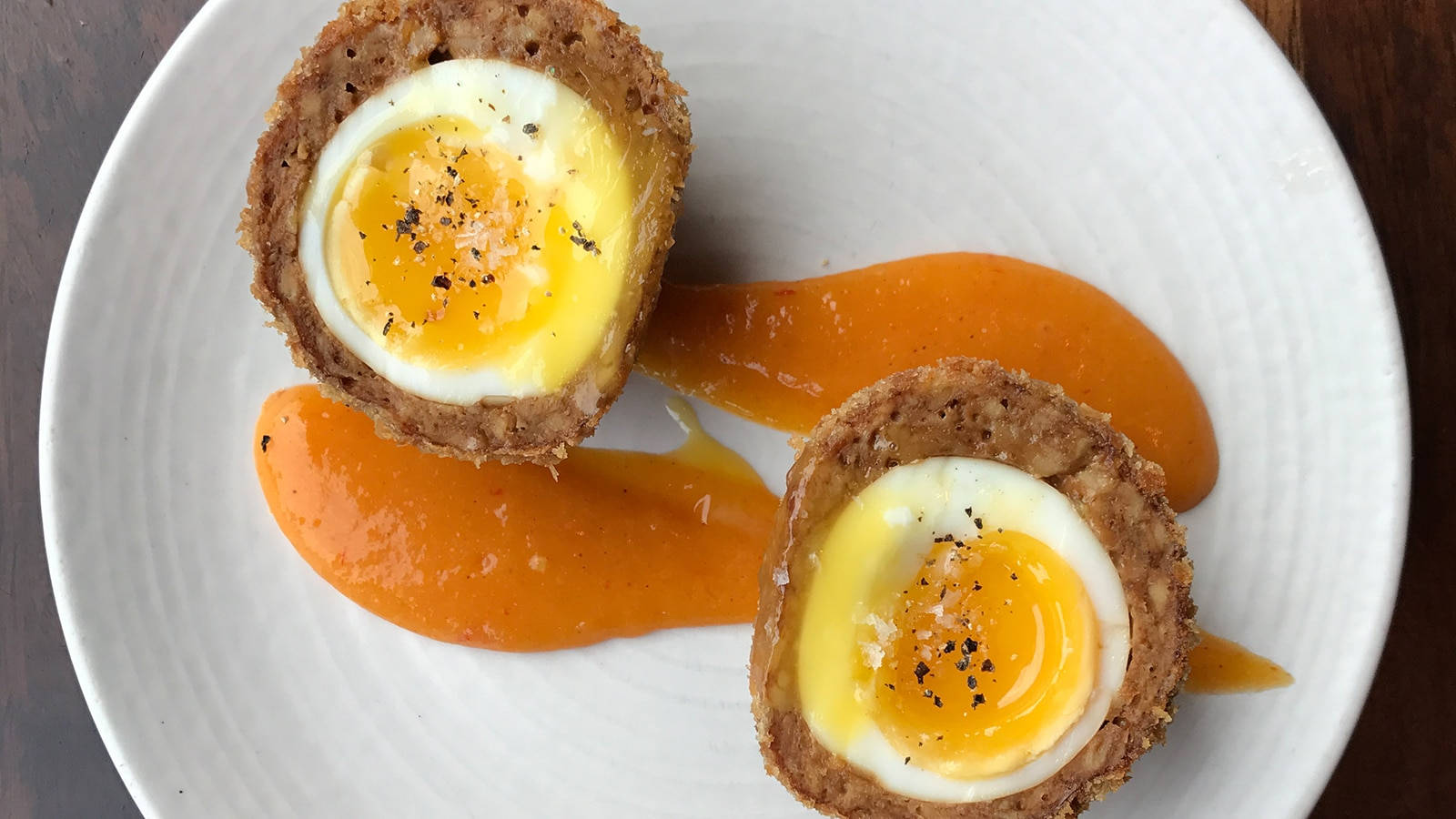 Scotch Eggs Dish With Mustard And Pepper Background