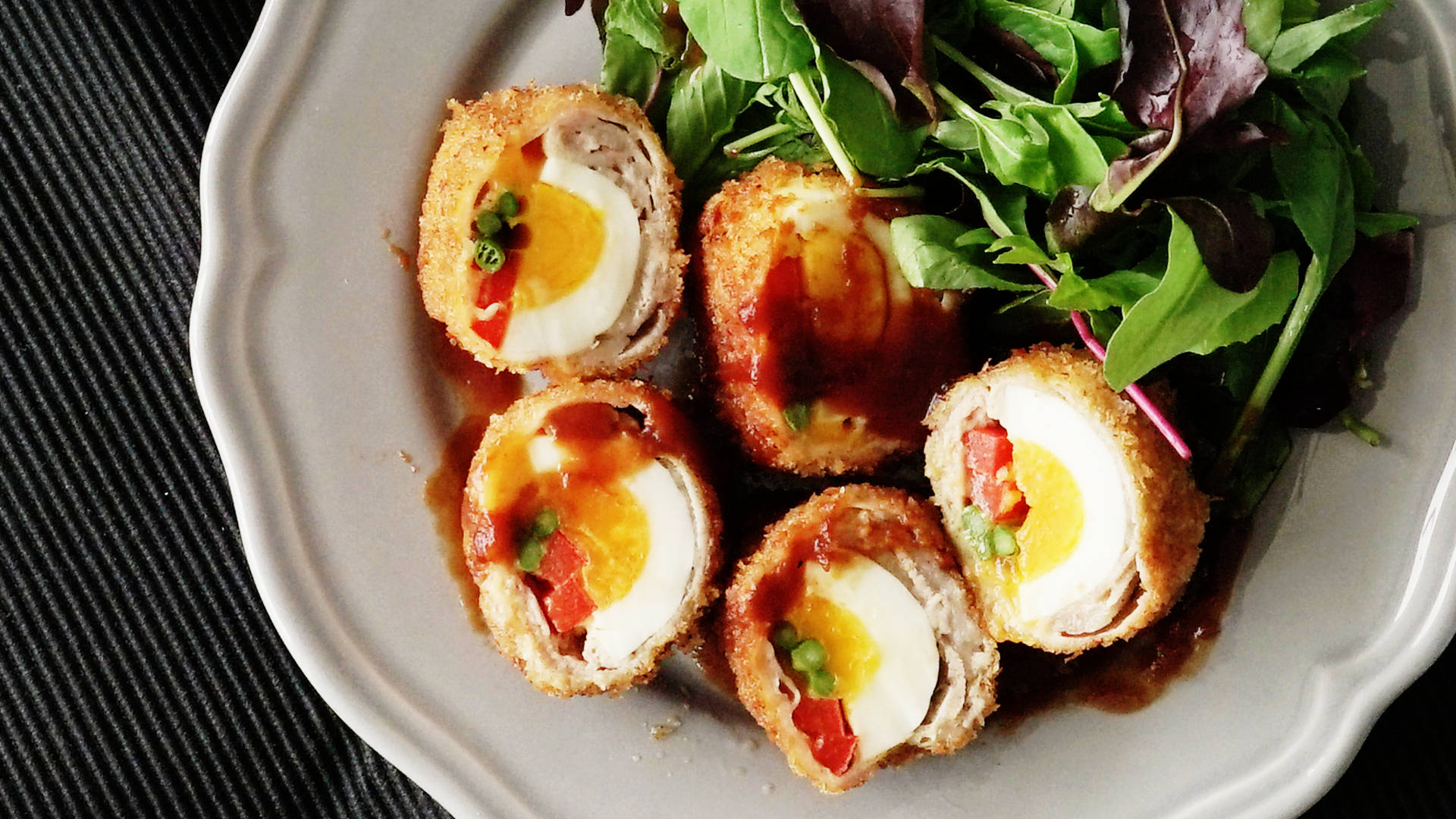 Scotch Eggs With Vegetables And Red Sauce Background