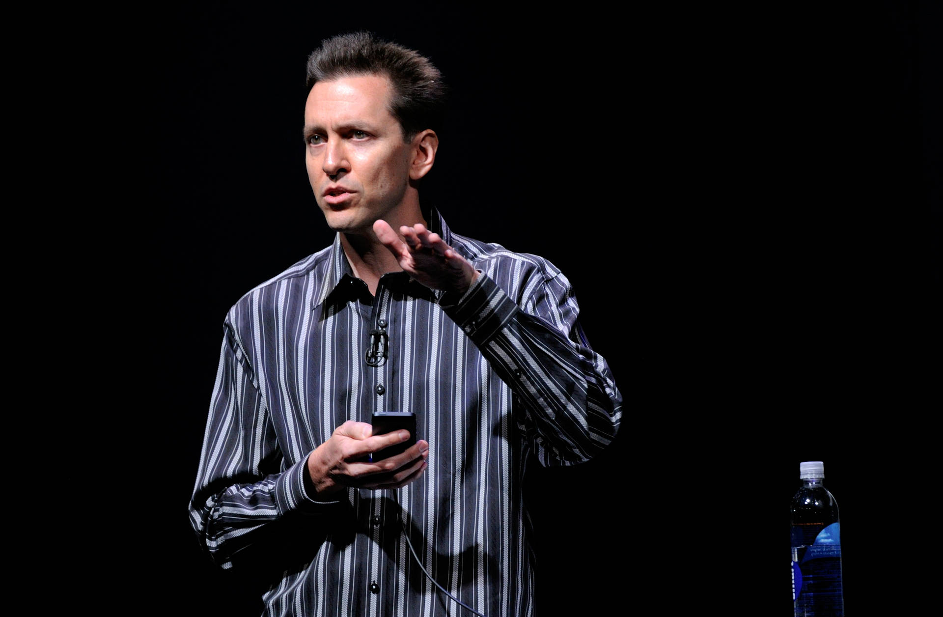 Scott Forstall Giving A Presentation Background