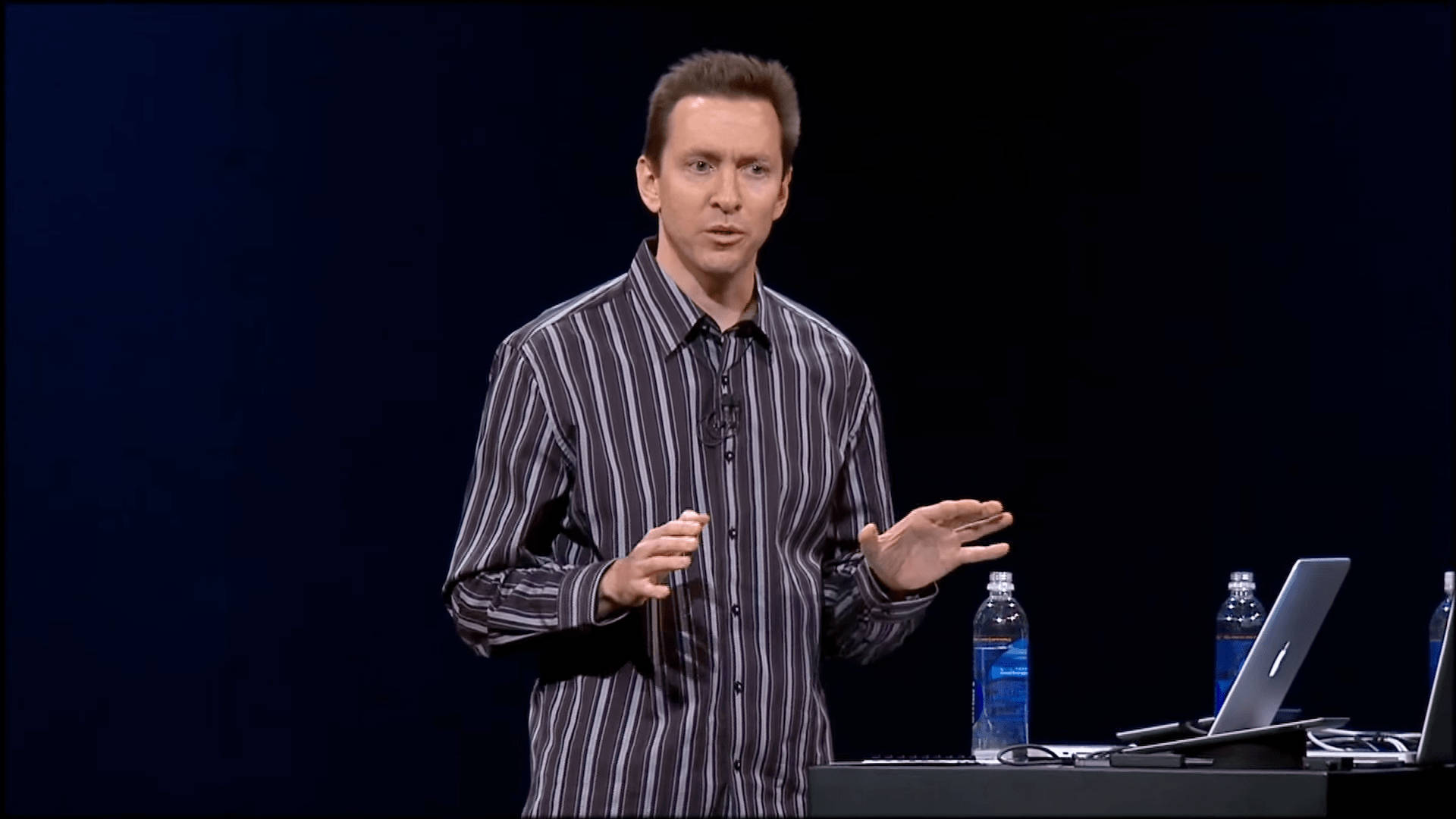 Scott Forstall In A Striped Shirt Background