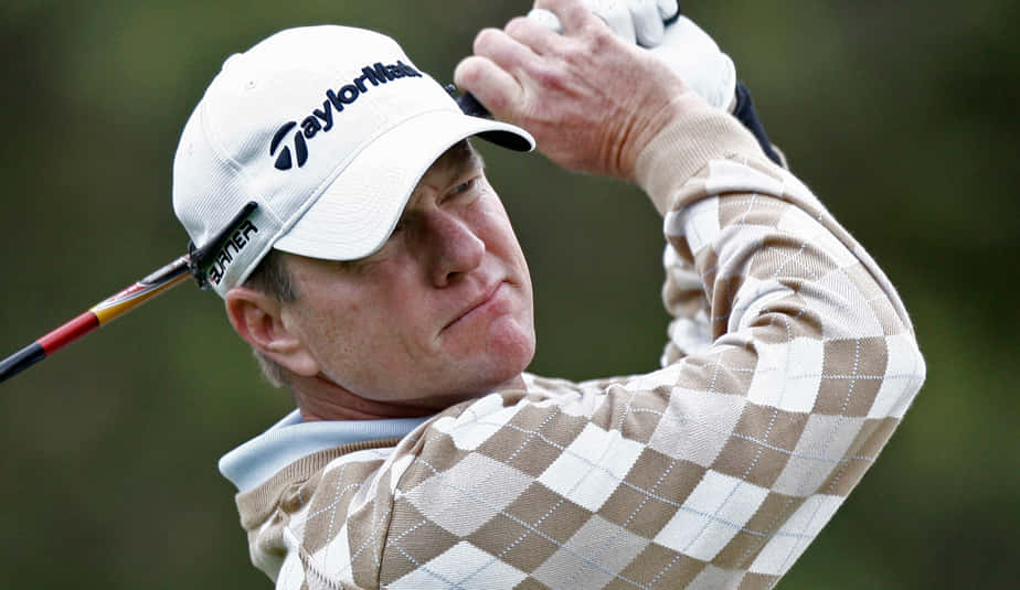 Scott Verplank In Action On The Golf Course Background