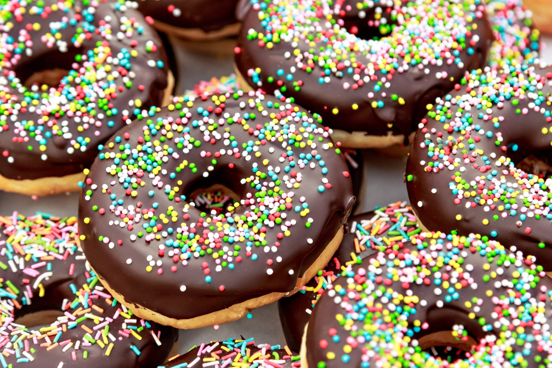 Scrumptious Chocolate Donuts Background
