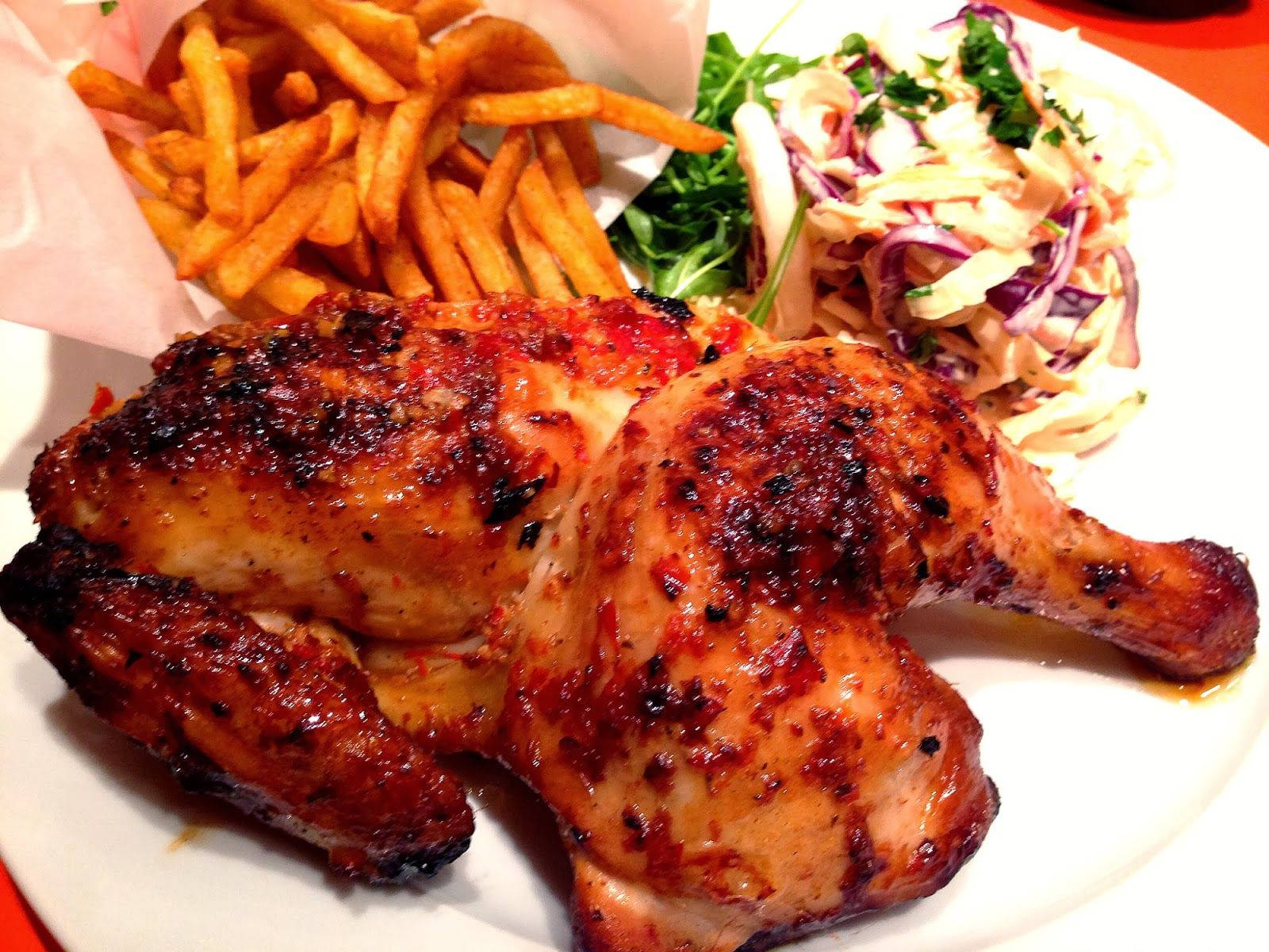 Scrumptious Peri Peri Chicken With Coleslaw And Fries Background