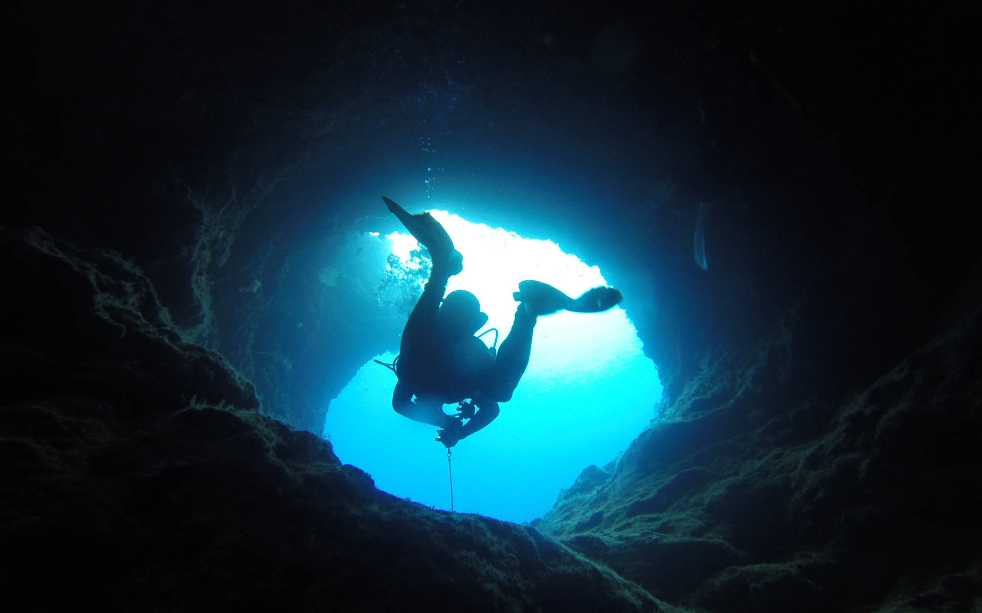 Scuba Diver Swimming Underwater Cave Background