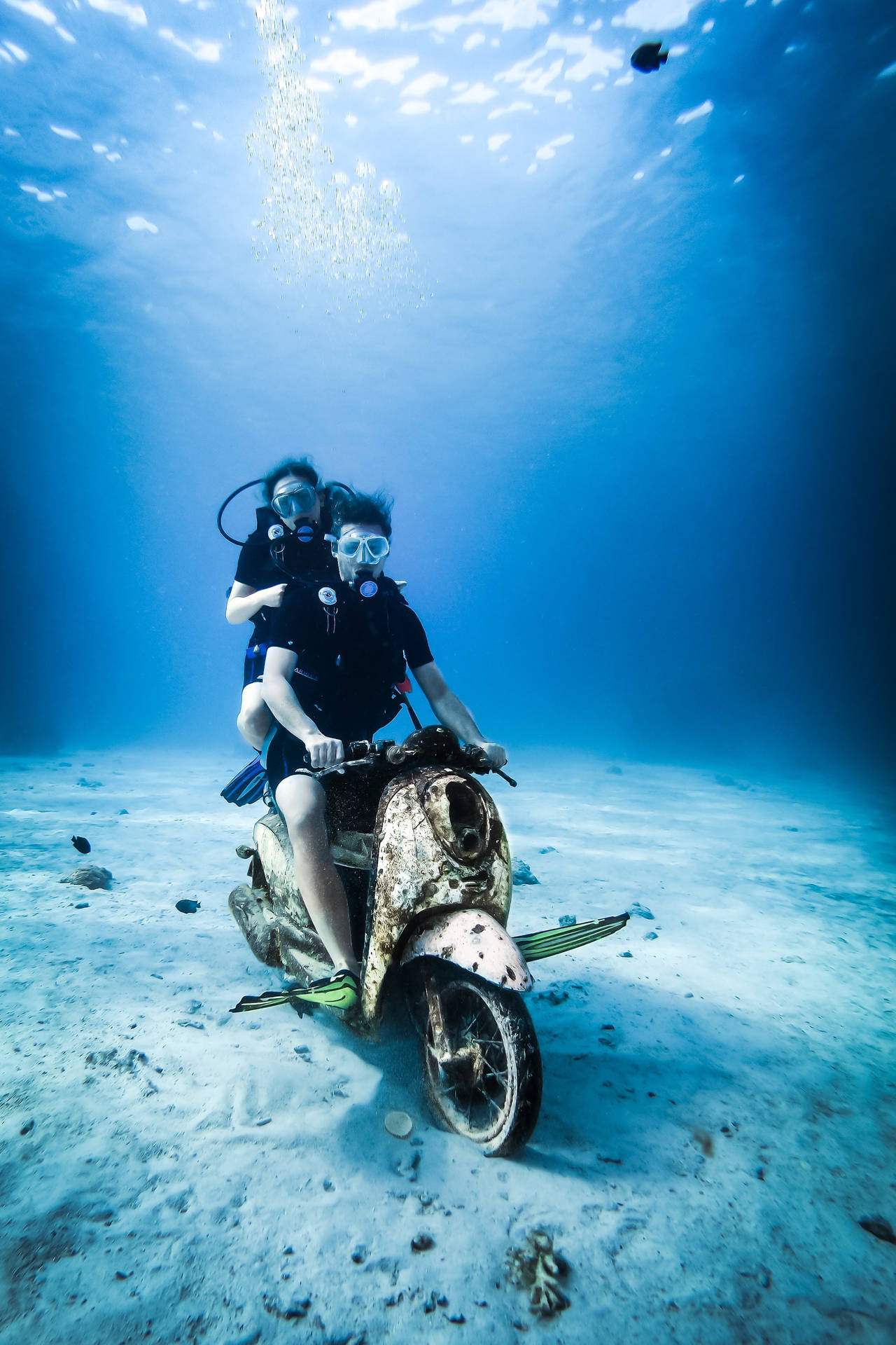 Scuba Diving And Riding Motorcycle Underwater Background