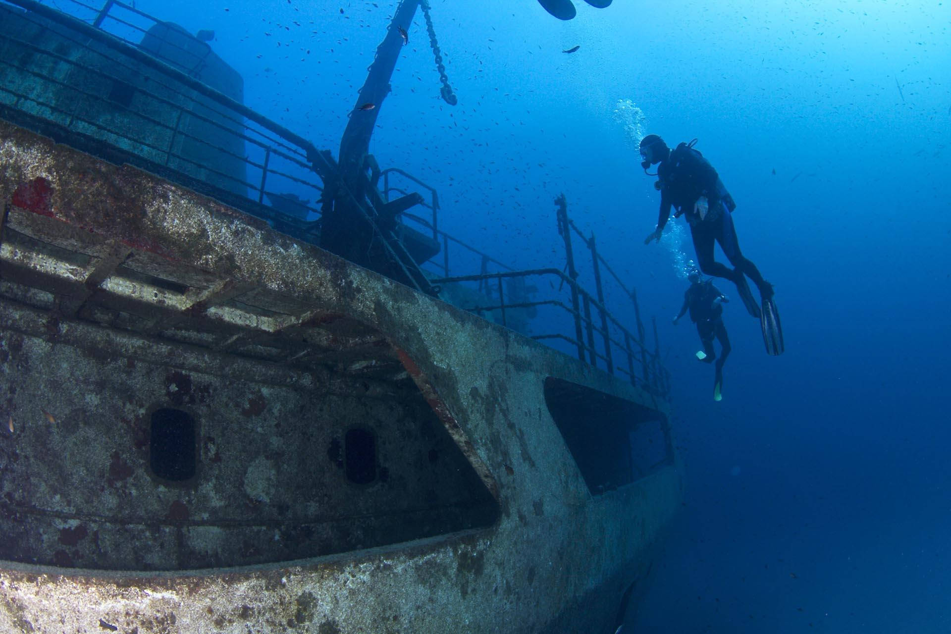 Scuba Diving Observing Sunken Ship Background