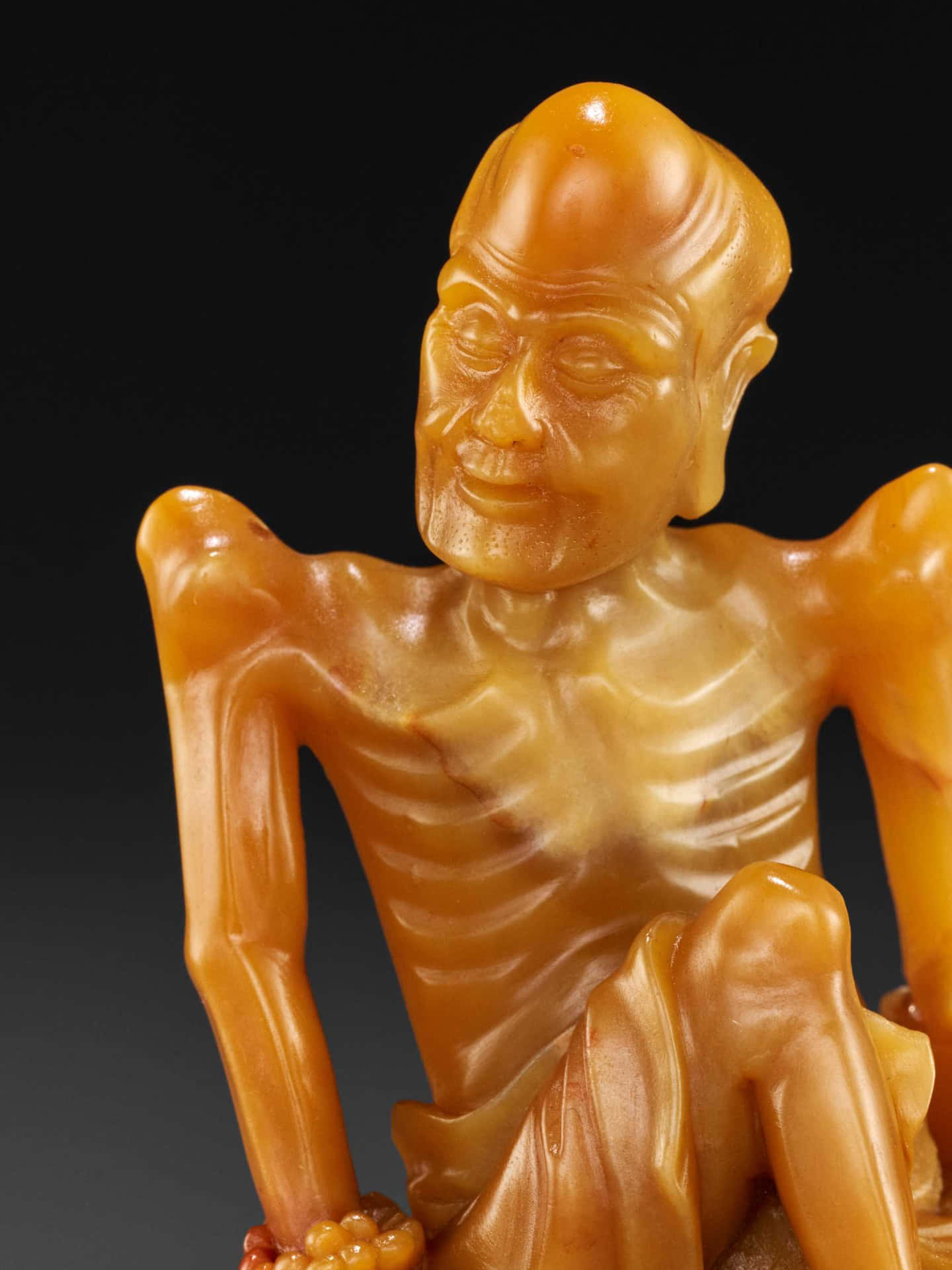 Sculpture Of An Emaciated Old Man Background
