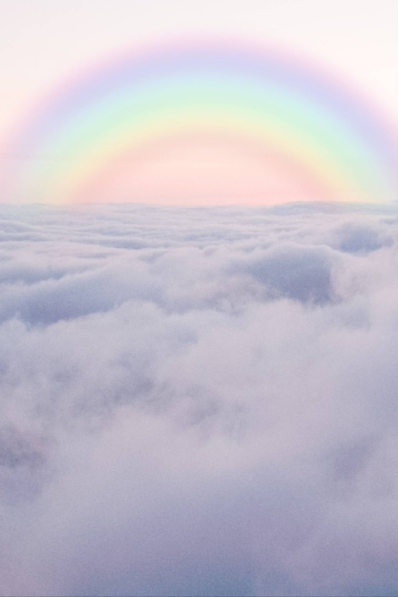 Sea Of Clouds With Pastel Rainbow Background