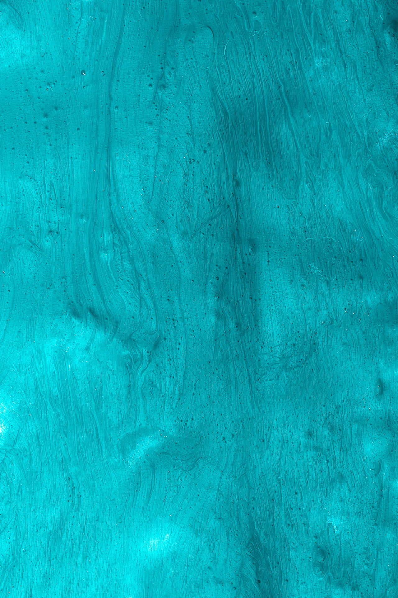 Seamless Integration Of Style And Technology With The Turquoise Iphone Background