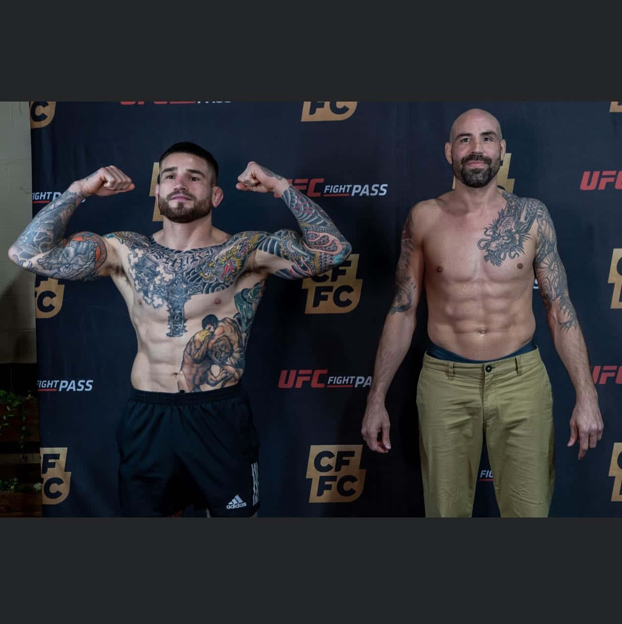 Sean Brady Next To Topless Man