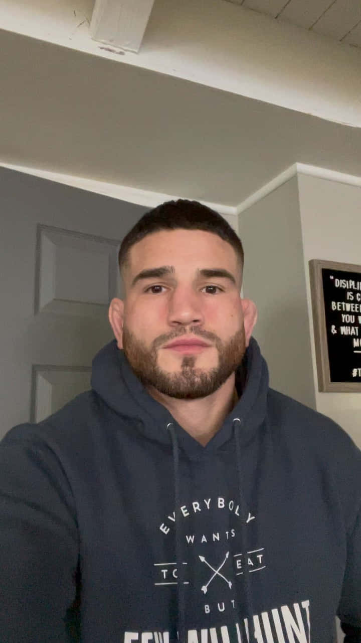 Sean Brady Wearing A Hoodie Background