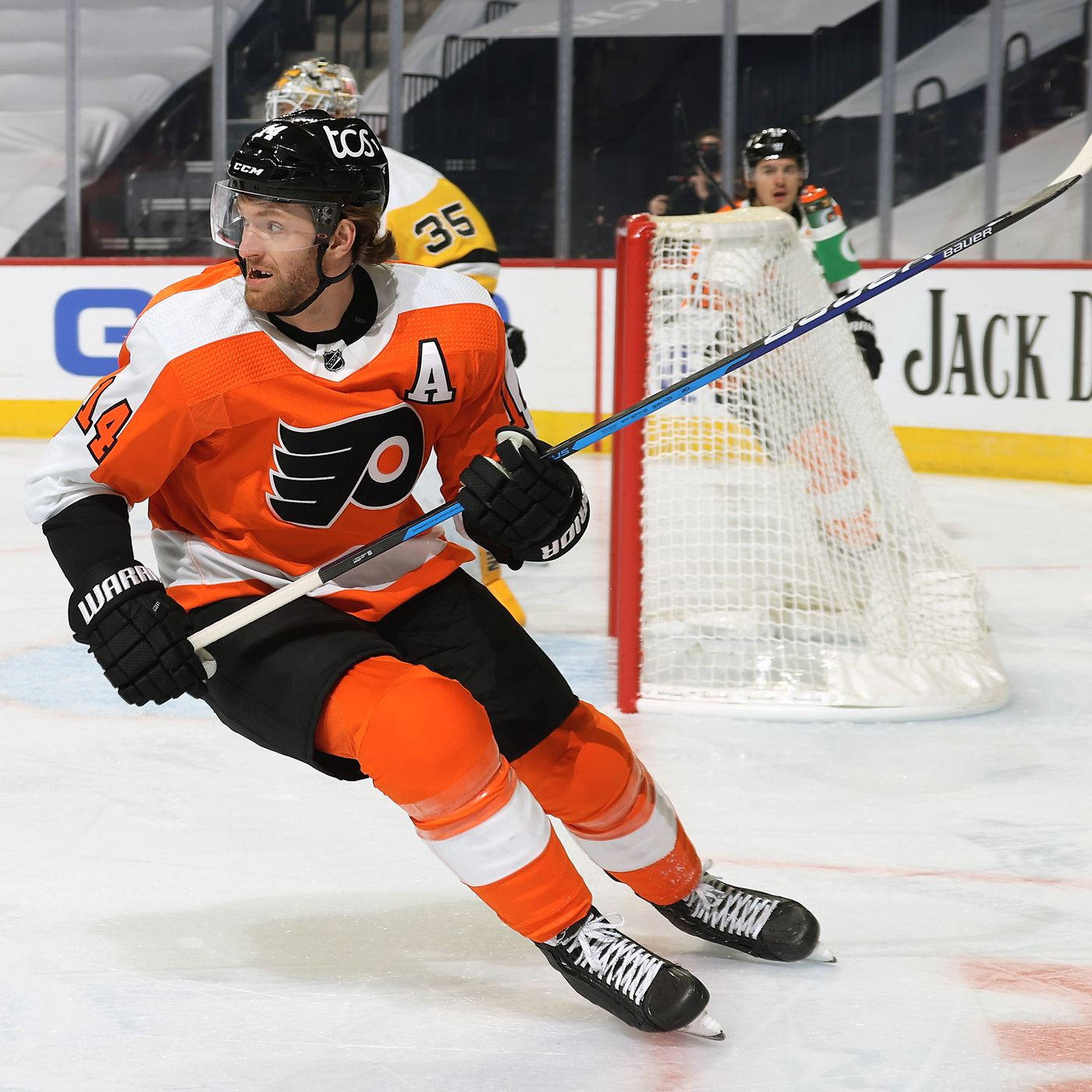 Sean Couturier Gliding On Ice Rink Background