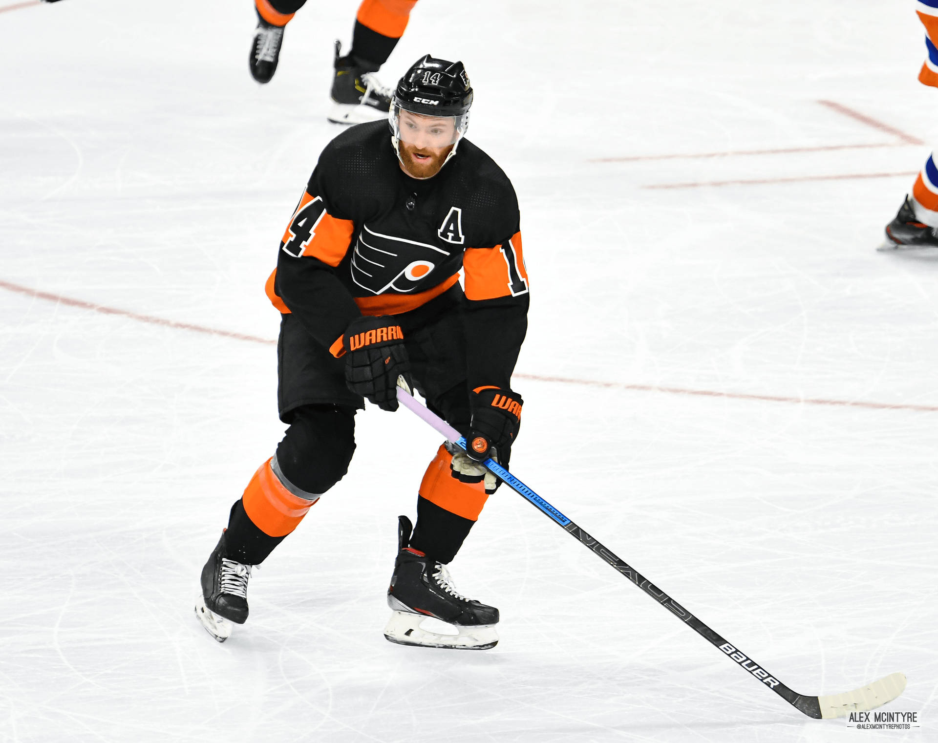 Sean Couturier In Orange And Black Uniform Background