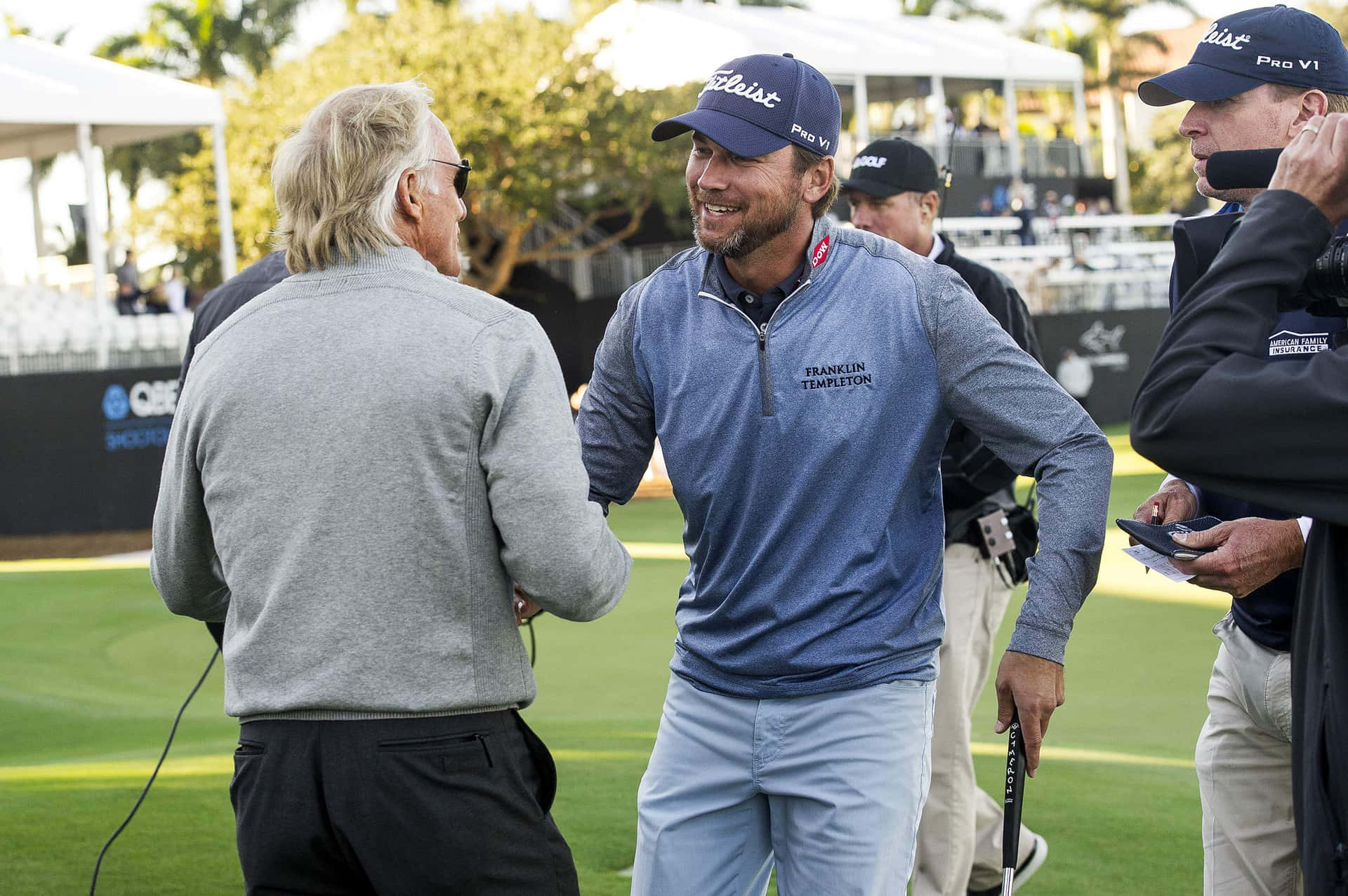 Sean O'hair Shakes Hands With Greg Norman Background