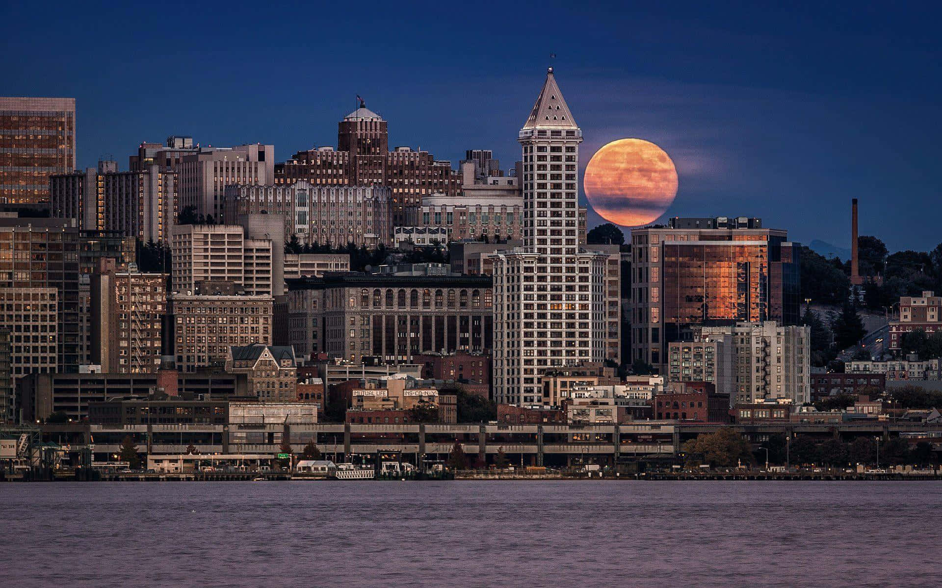 Seattle At Night With Full Moon Background