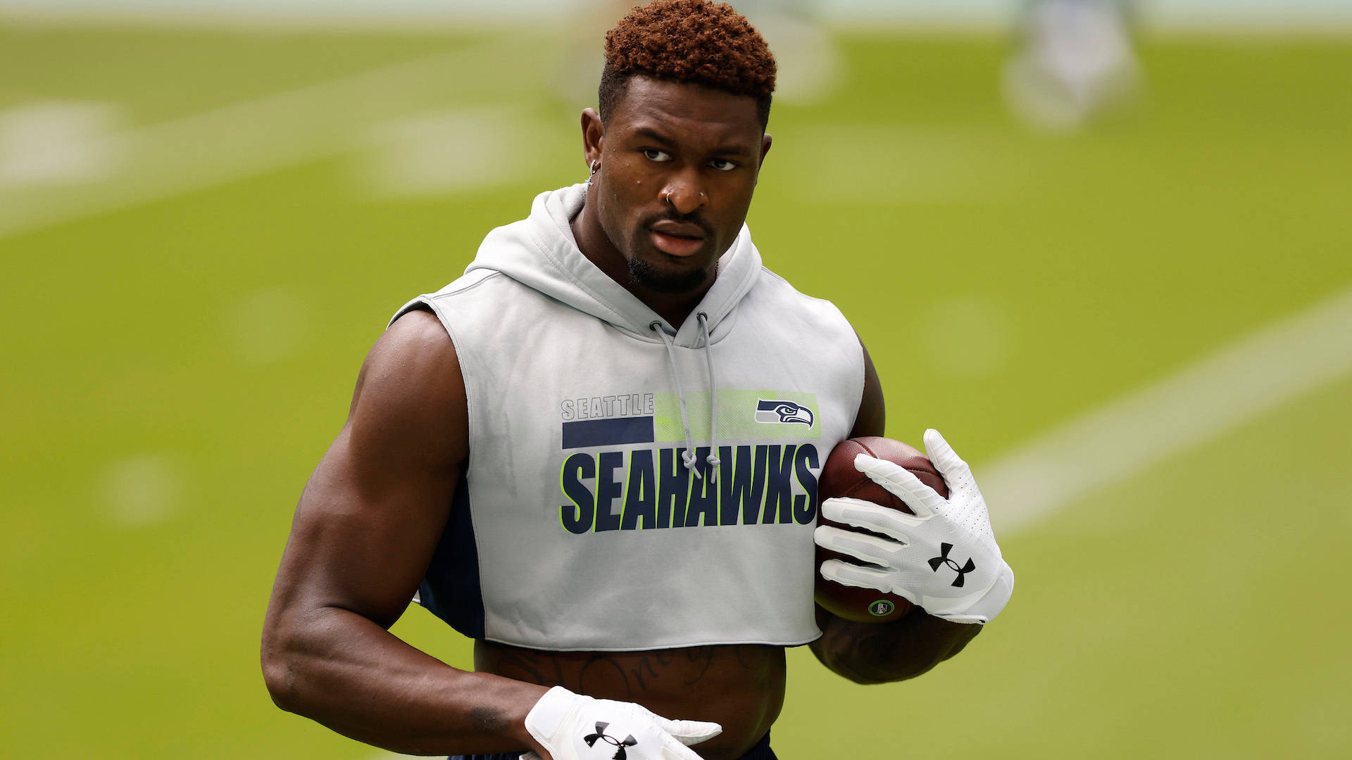Seattle Seahawks’ Star Dk Metcalf In Casual White Attire Background