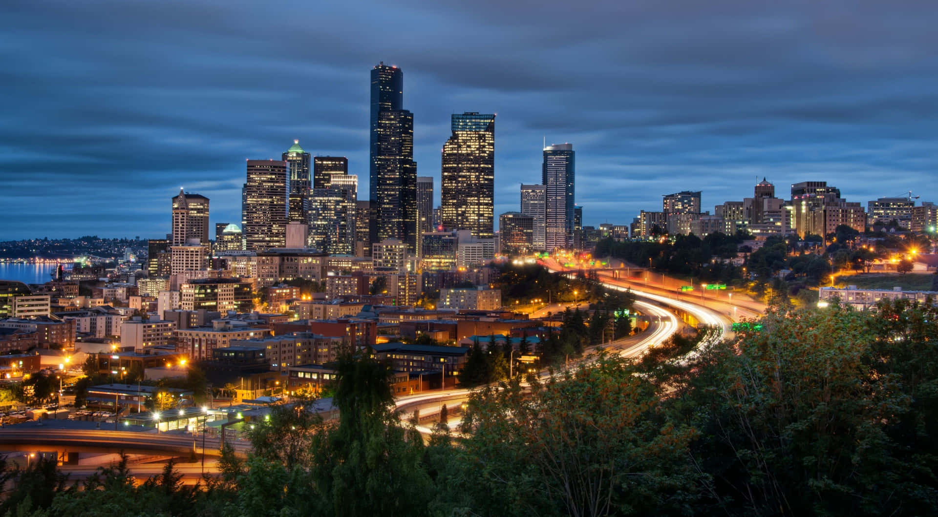 Seattle Skyline At Dusk With Traffic And Cars