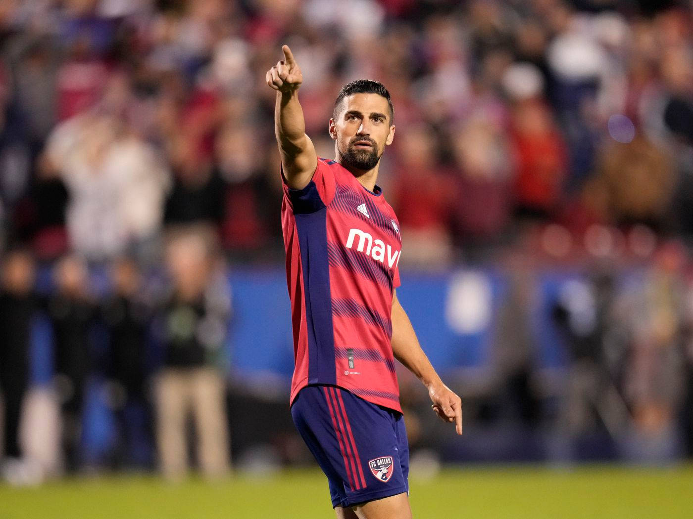 Sebastian Lletget Pointing To The Crowd Background