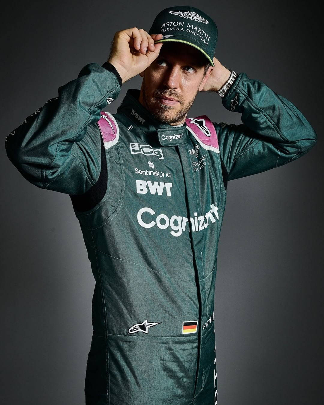 Sebastian Vettel Green Suit And Cap Background