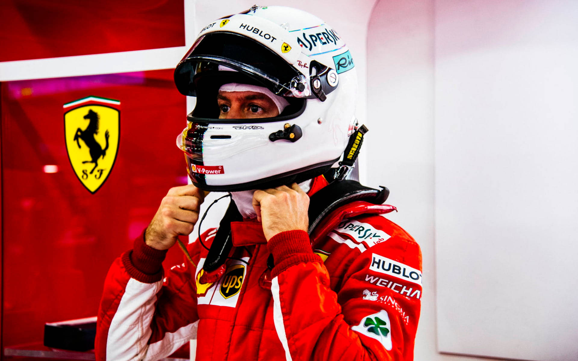 Sebastian Vettel In A Racing Suit Background