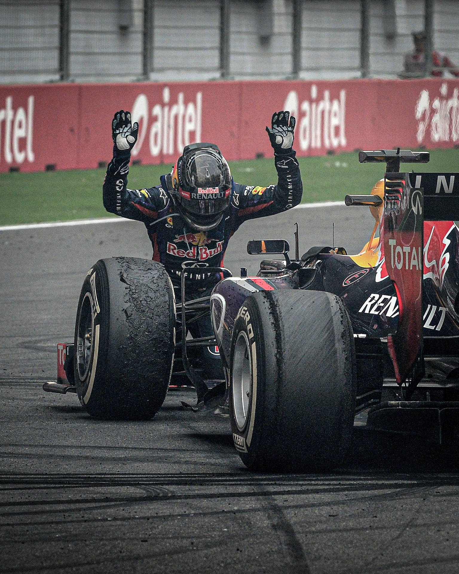 Sebastian Vettel Kneeling On The Track Background