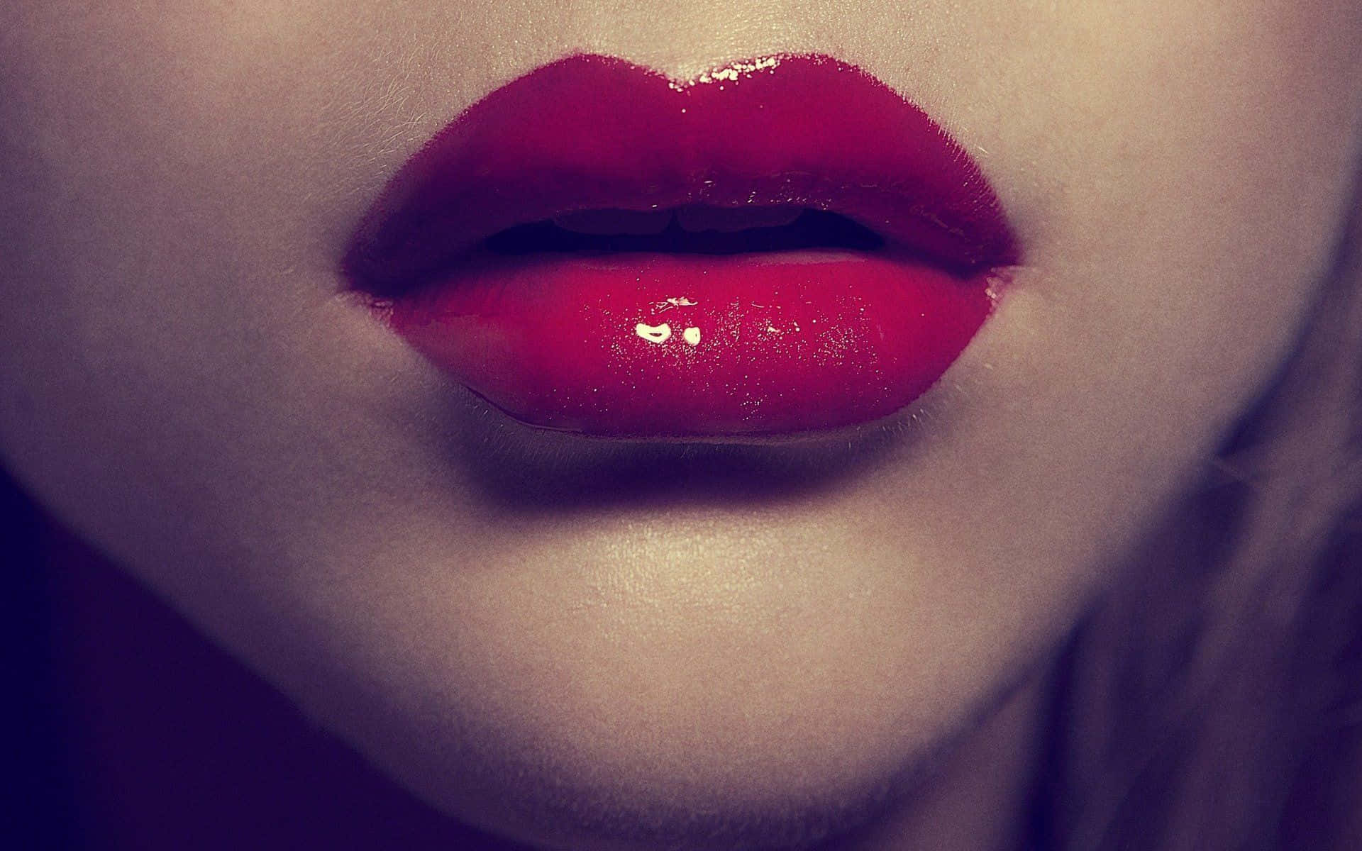 Seductive Red Lips On A Mesmerizing Face Background