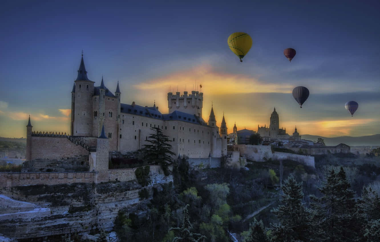 Segovia Castle With Hot Air Balloons Background