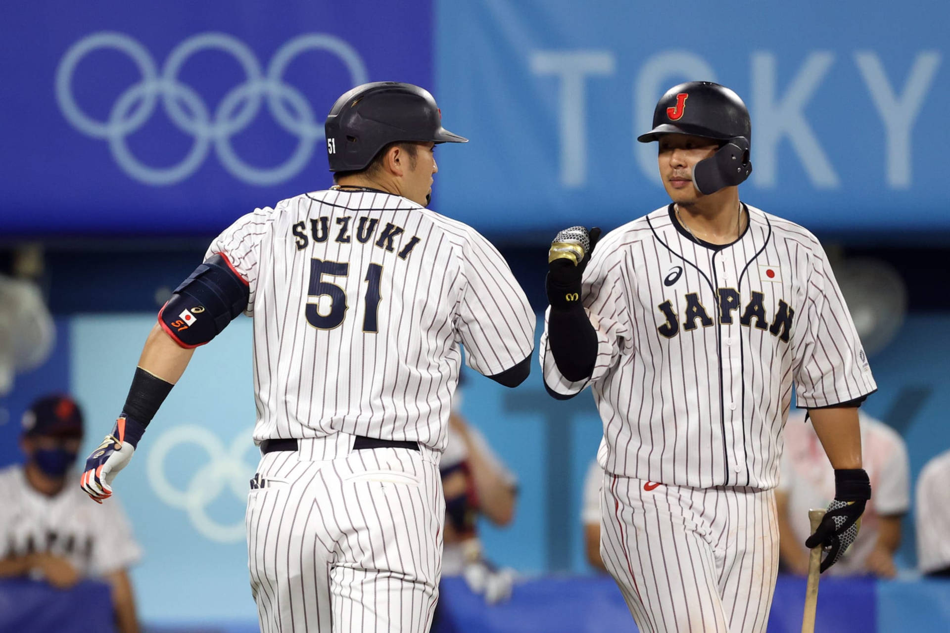 Seiya Suzuki Celebrating Success With A Fist Bump Background