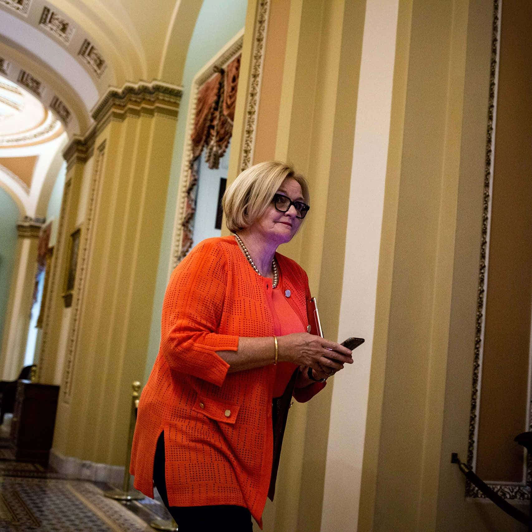 Senator Claire Mccaskill Walking Through Capitol Hill Background