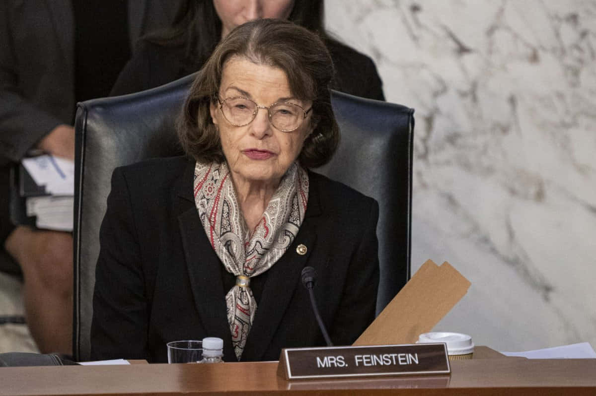 Senator Dianne Feinstein Delivering A Speech Background