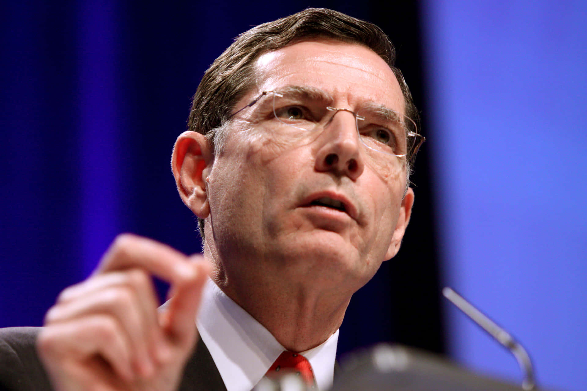 Senator John Barrasso Making A Hand Gesture Background