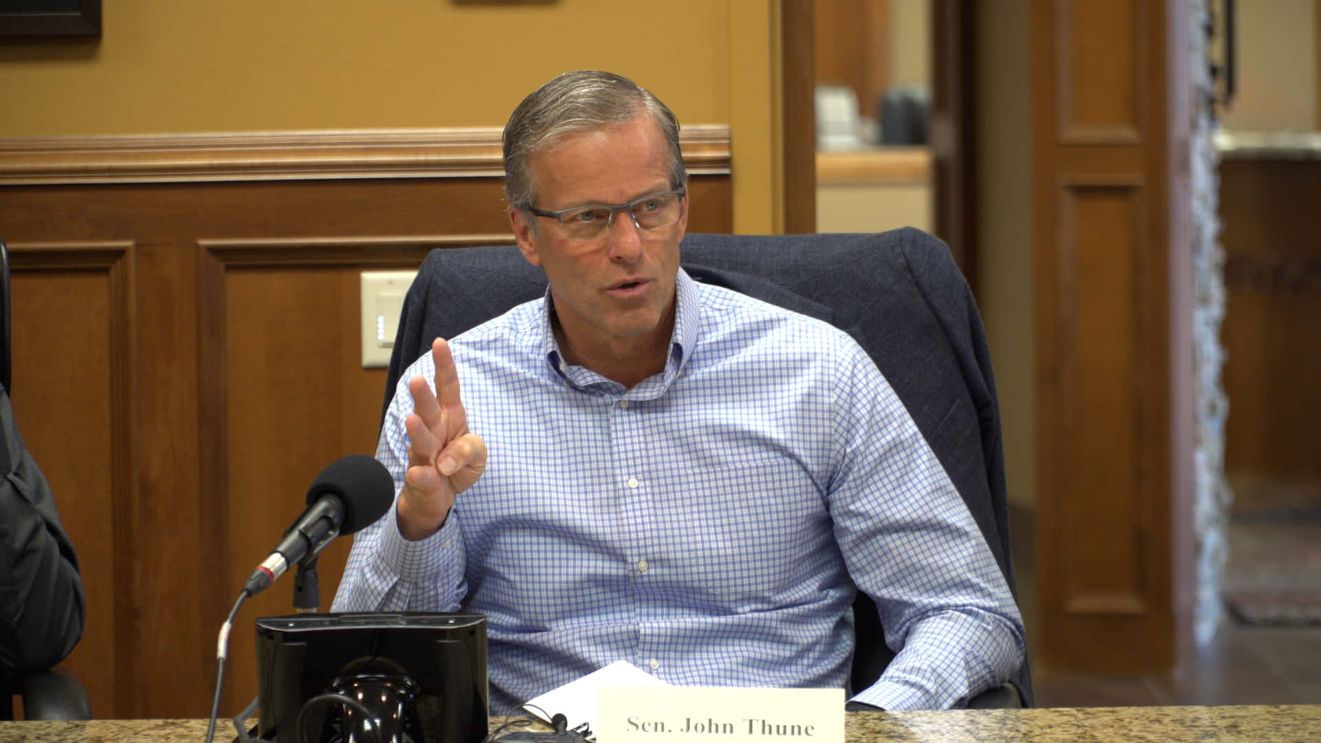 Senator John Thune Delivering A Speech Background