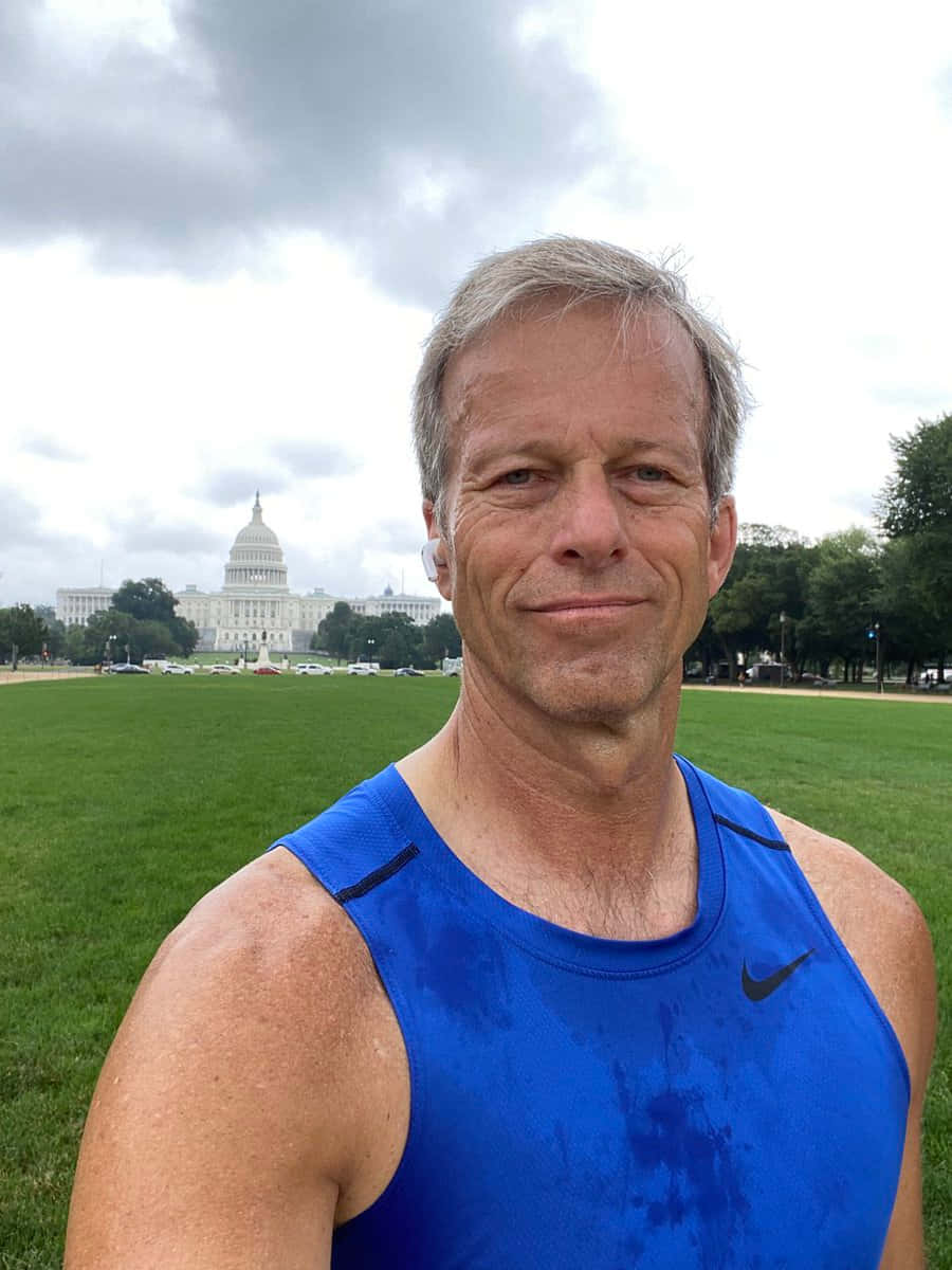 Senator John Thune In Sports Attire Background