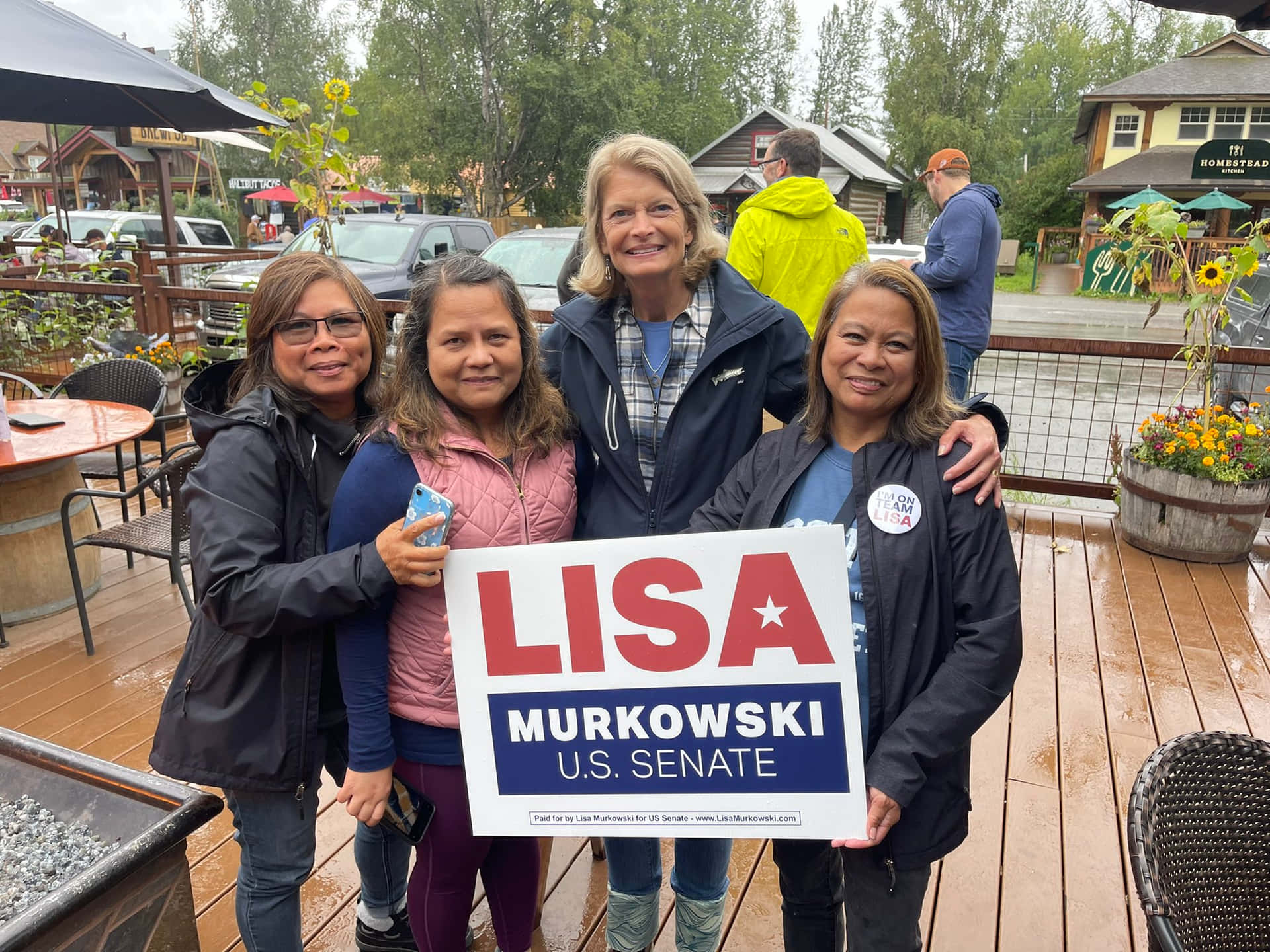Senator Lisa Murkowski Hugging Supporters Background