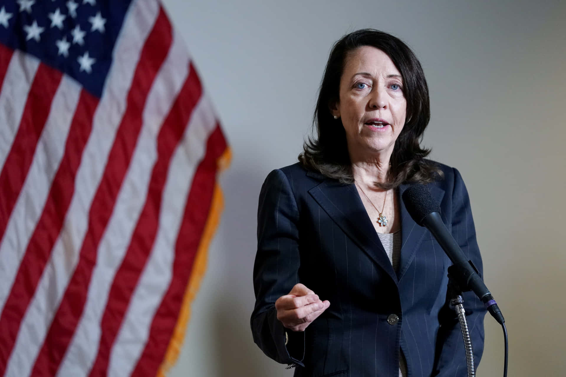 Senator Maria Cantwell Pays Respect To America’s Flag Background