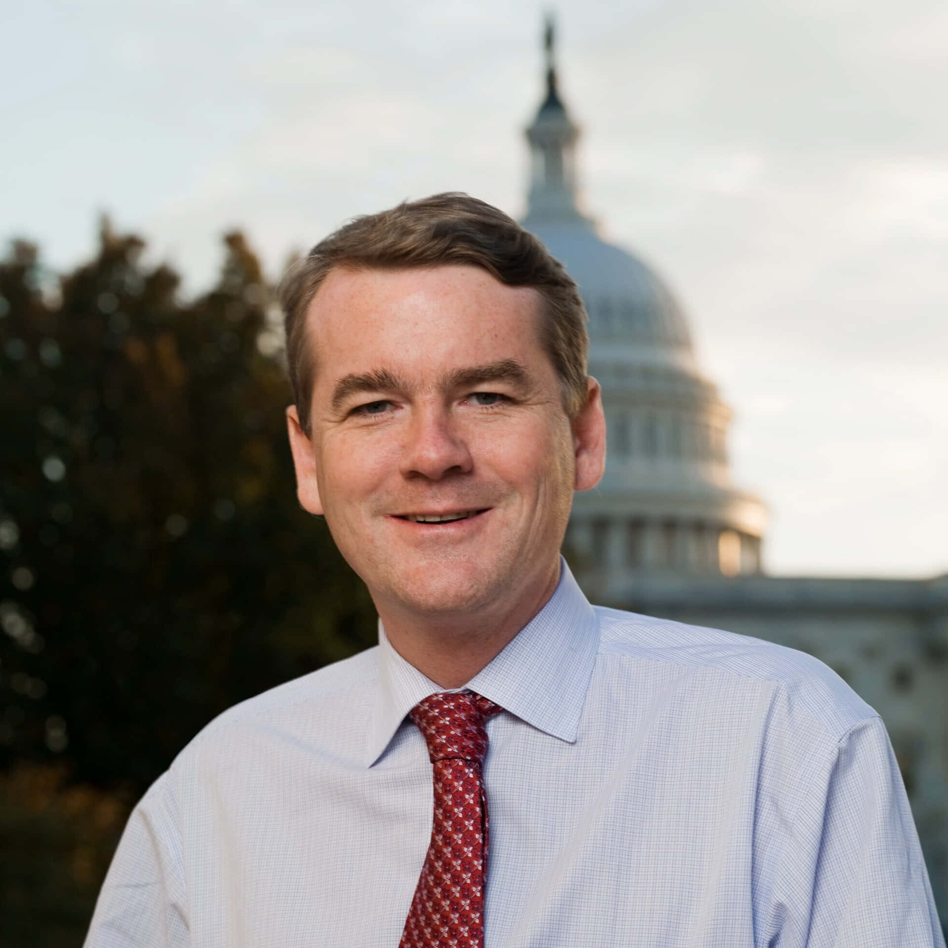 Senator Michael Bennet Smiling Background