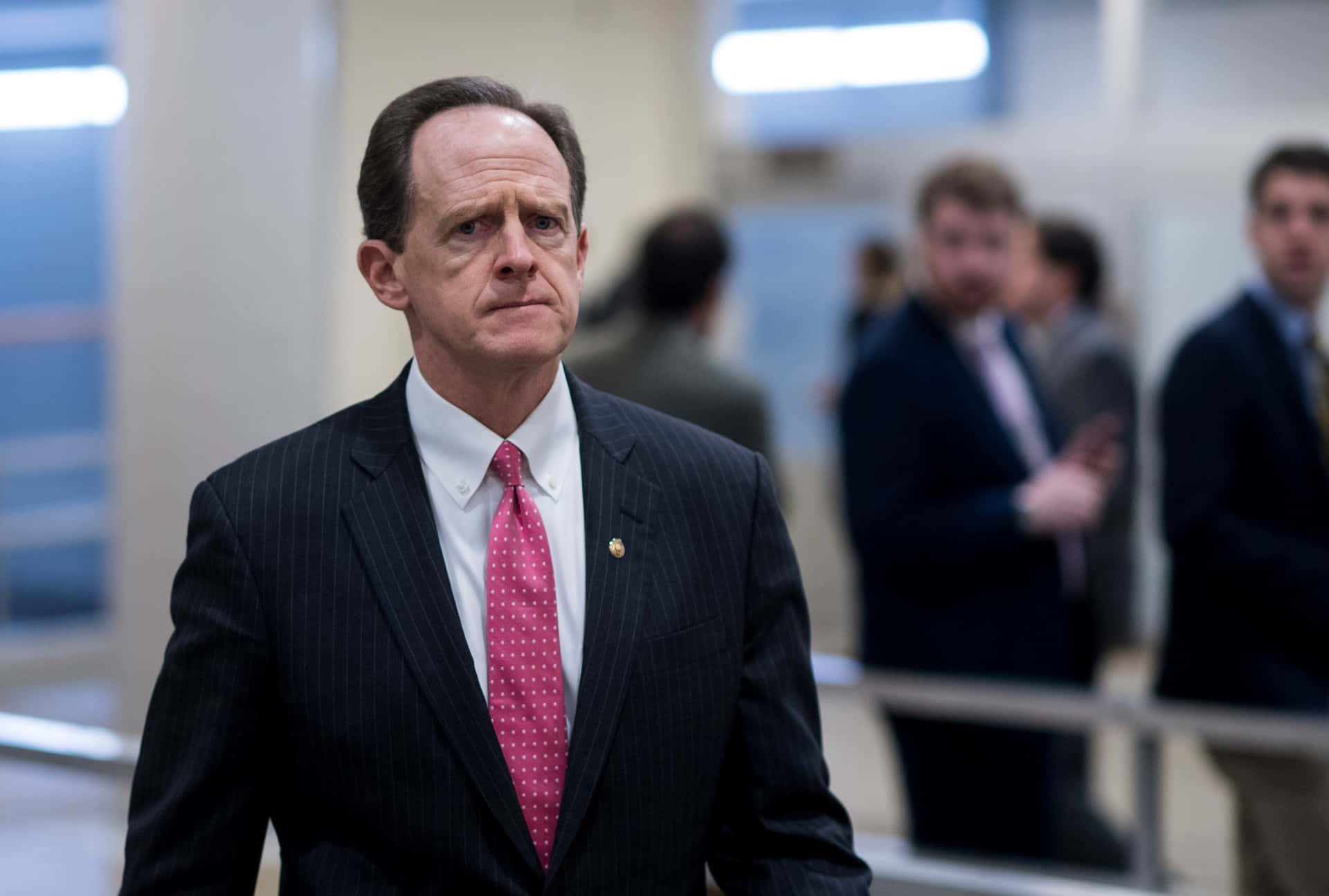 Senator Pat Toomey Walking Through A Hallway