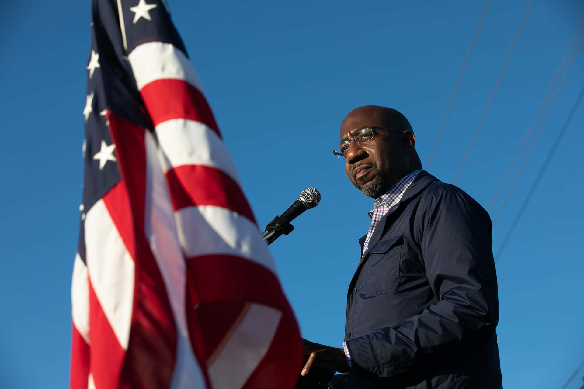 Senator Raphael Warnock Delivering A Thoughtful Speech Background