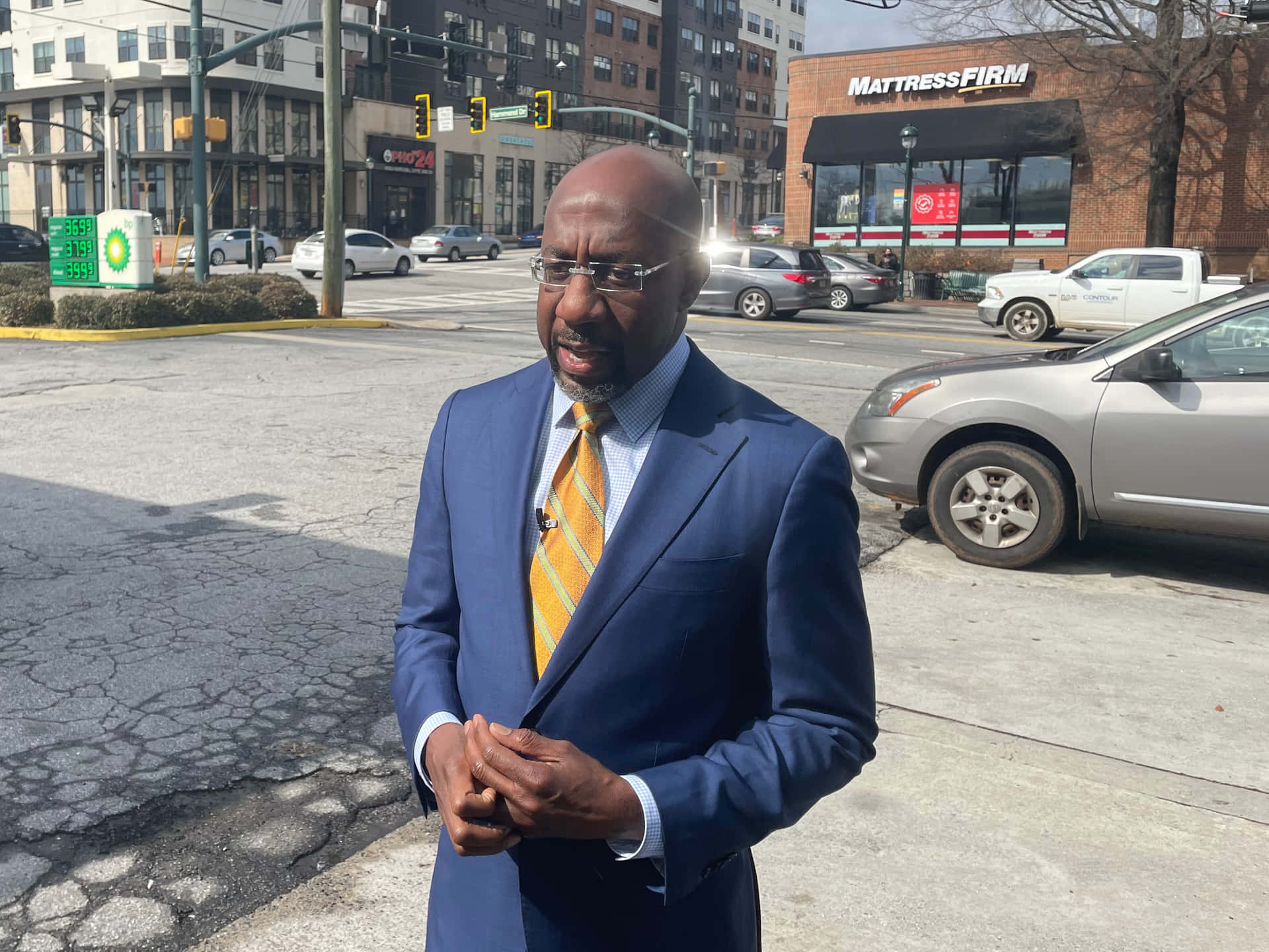 Senator Raphael Warnock In Street Background