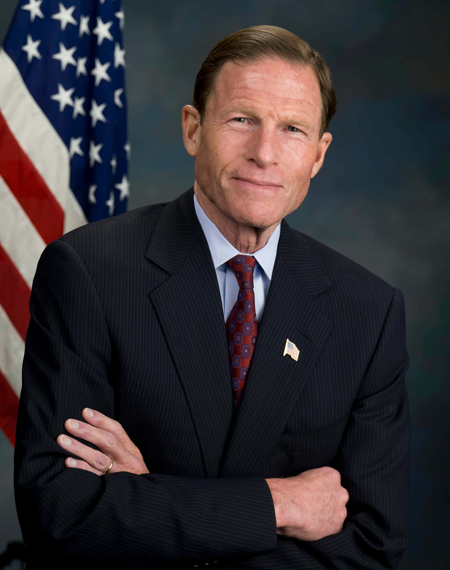 Senator Richard Blumenthal Posing With Crossed Arms Background