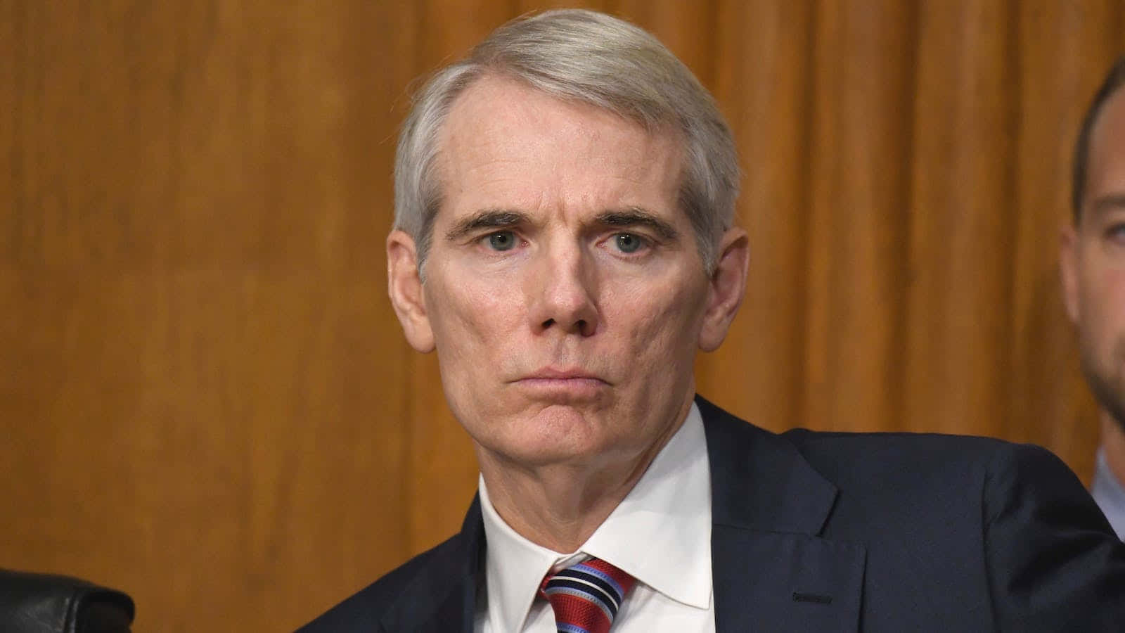 Senator Rob Portman Posing In A Formal Attire Background