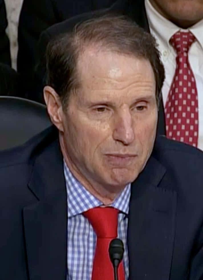 Senator Ron Wyden In A Red Tie Background