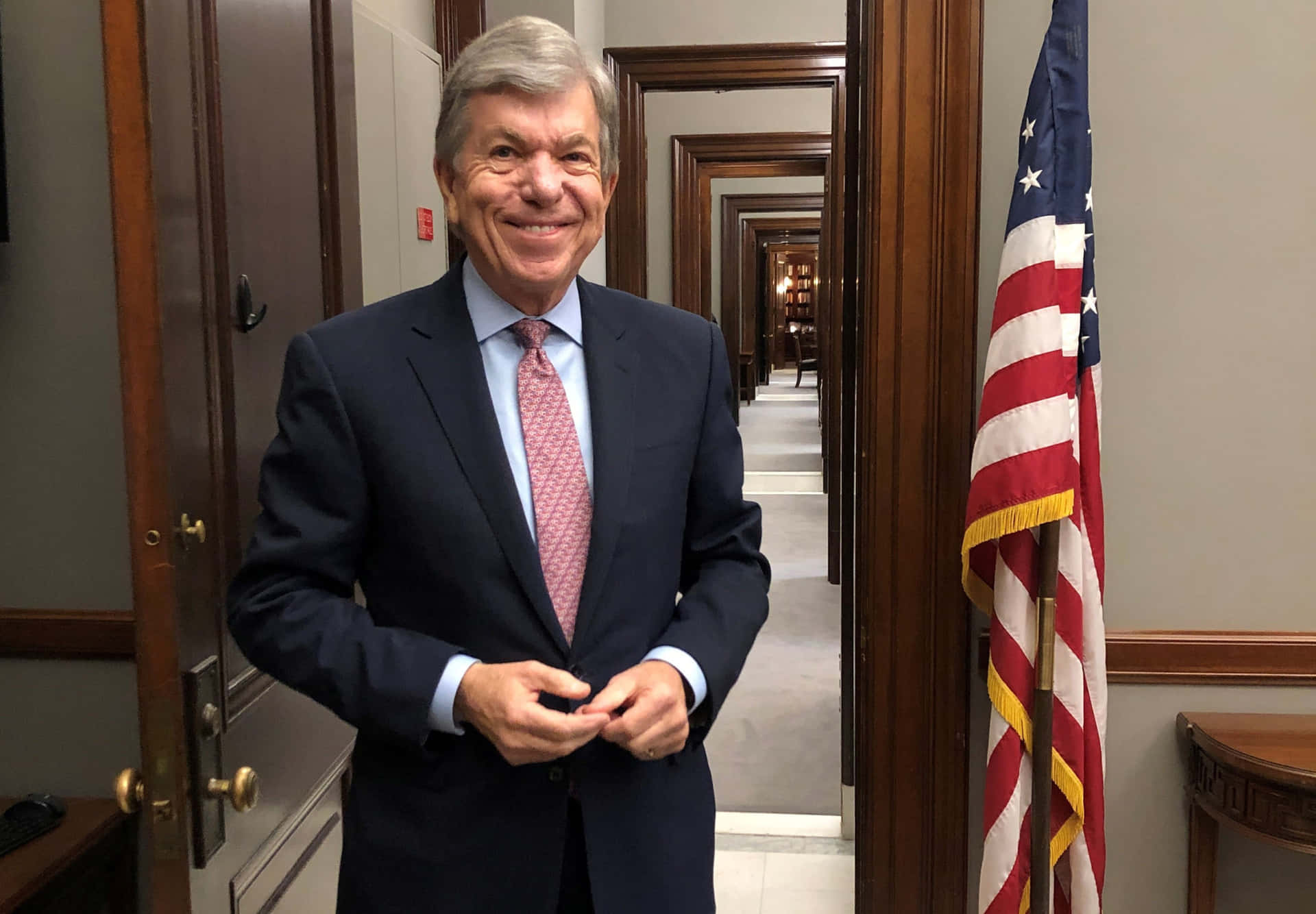 Senator Roy Blunt Standing By A Door. Background